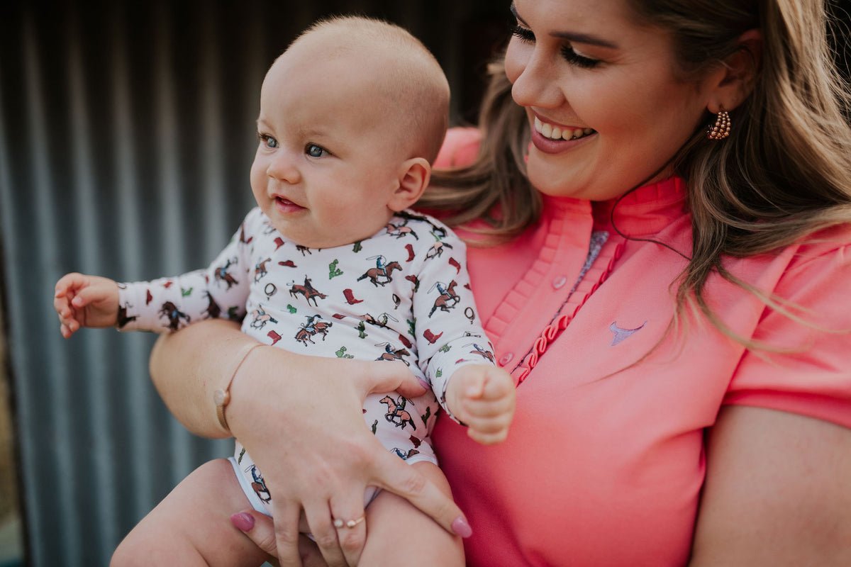 Kids wearing slow-fashion country clothing outdoors with Easter gift alternatives