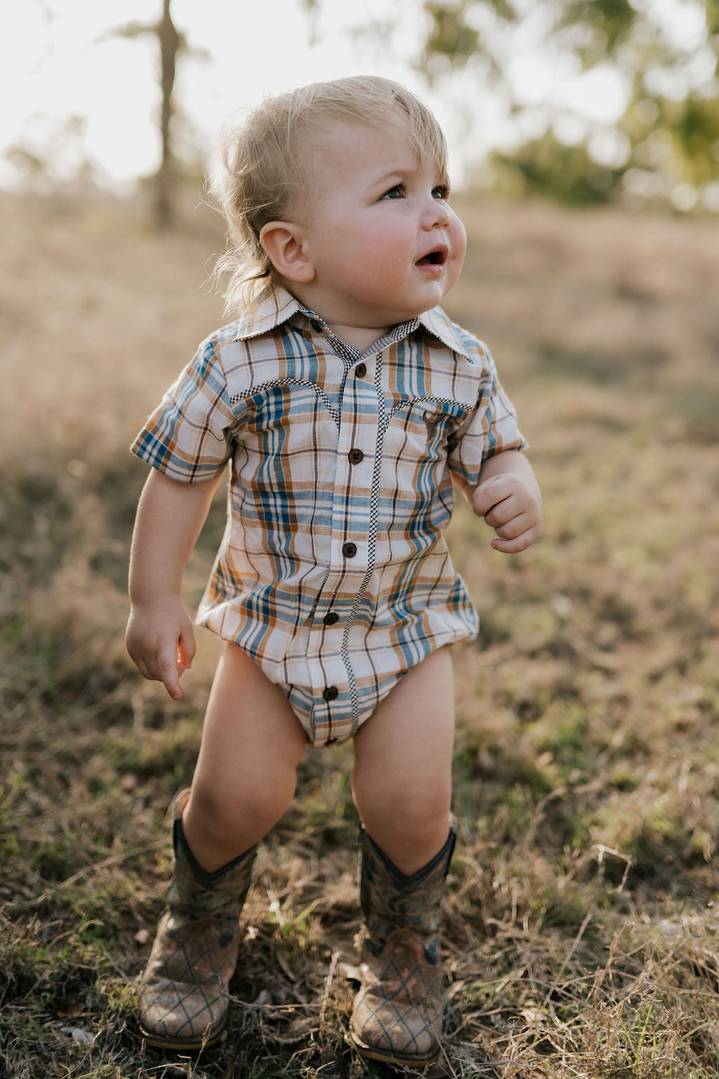 Dallas checked tan short sleeve romper front view showing classic tan check romper for toddlers