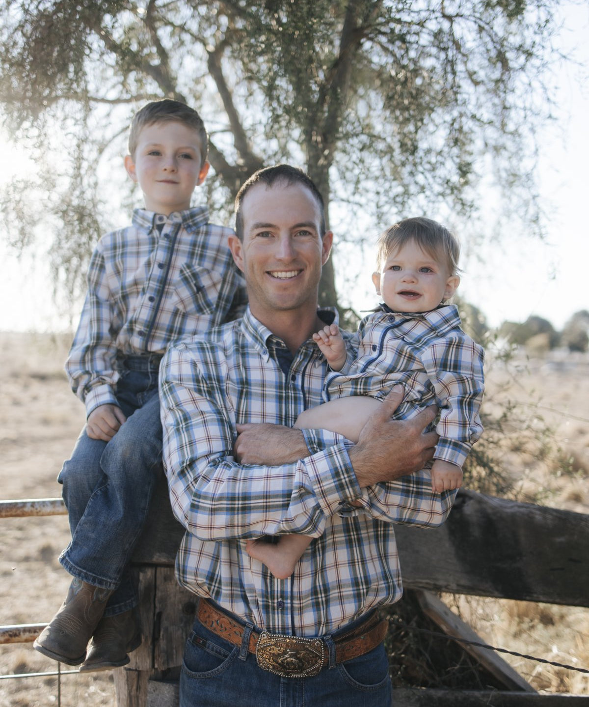 Dad and kids in matching blue plaid