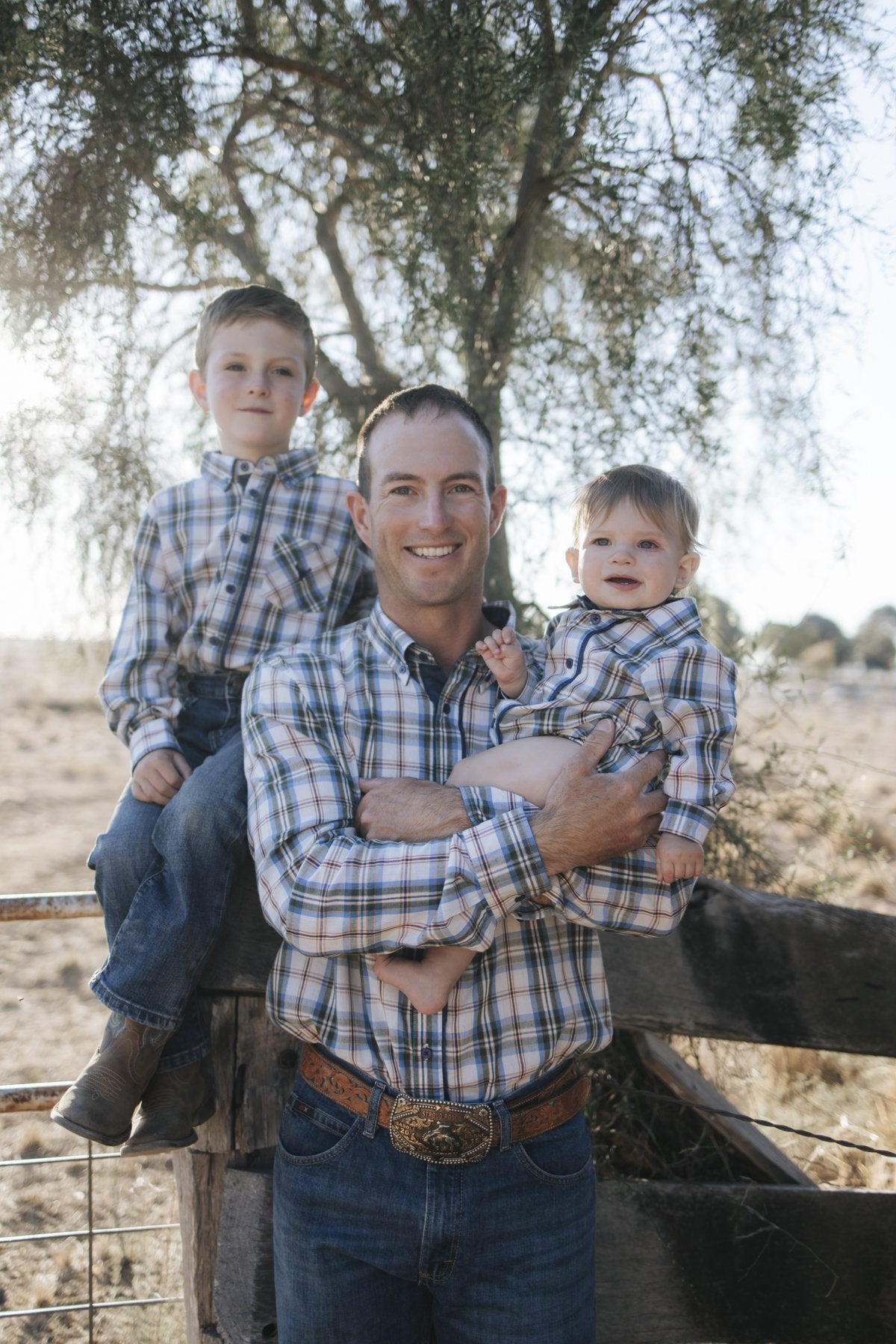 Dad and kids in matching blue plaid