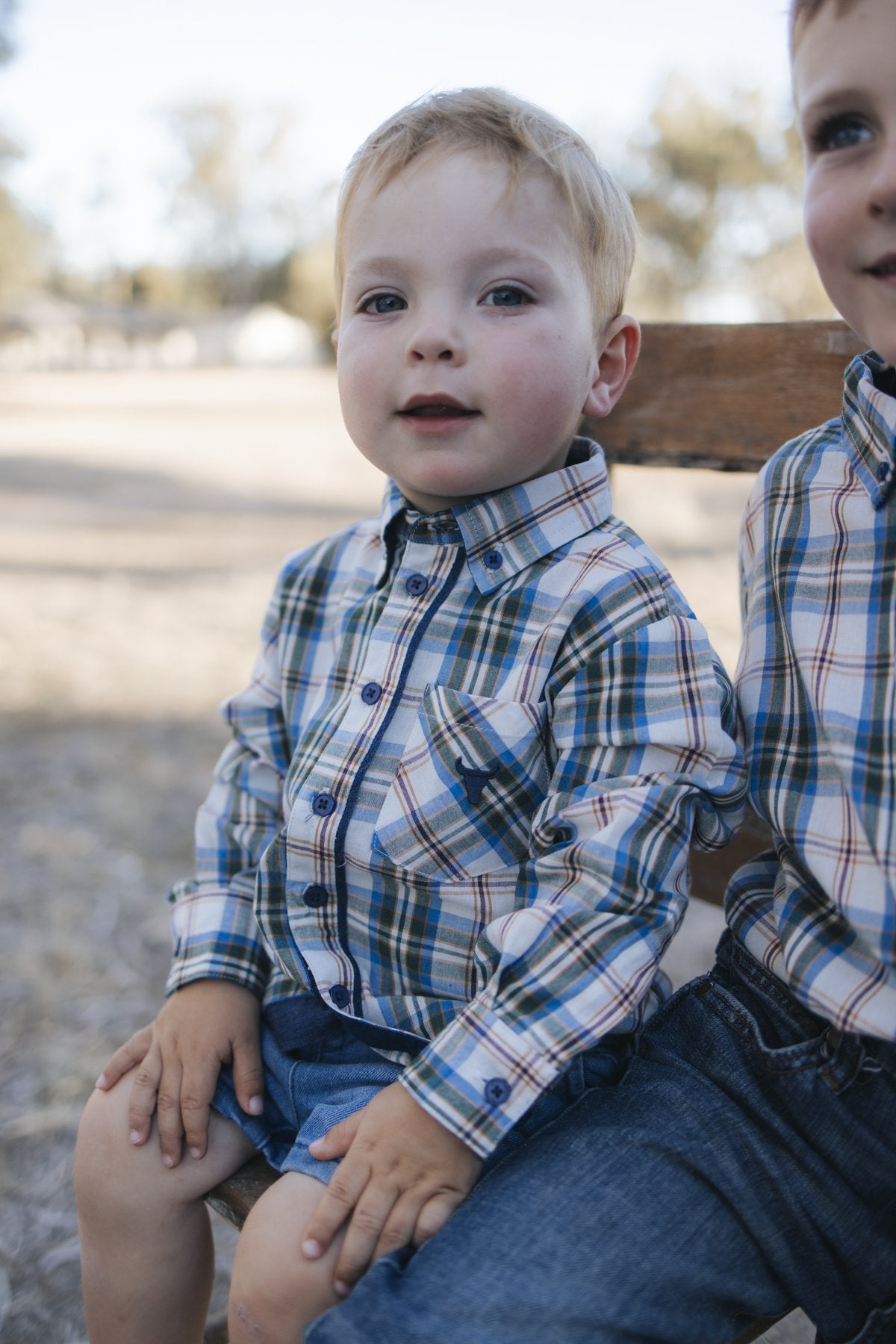 Blue plaid bodysuit with navy collar