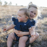 Denim romper with bull head embroidery