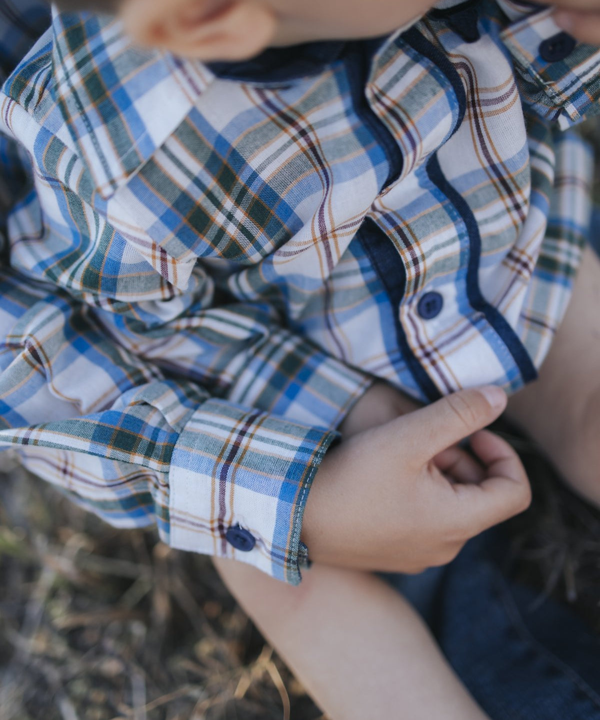 Blue plaid shirt button and cuff detail