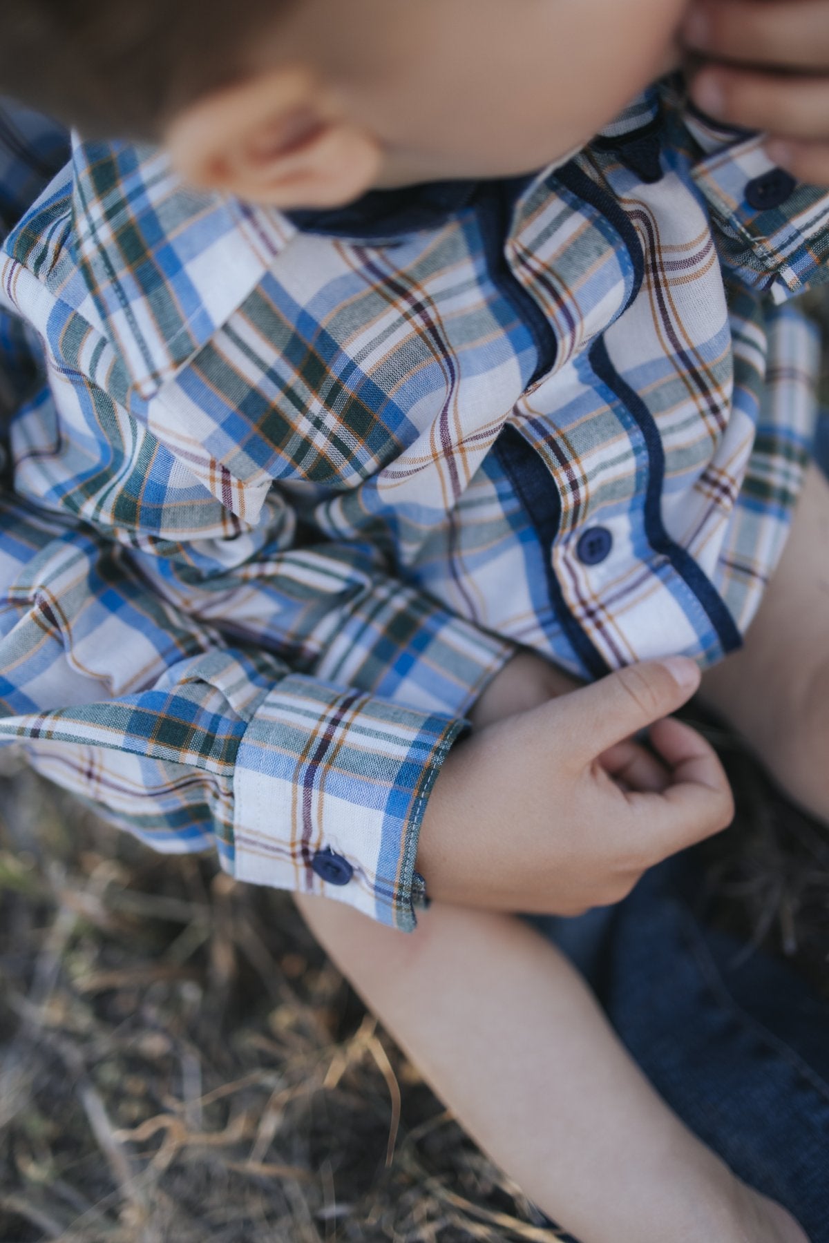 Blue plaid shirt button and cuff detail