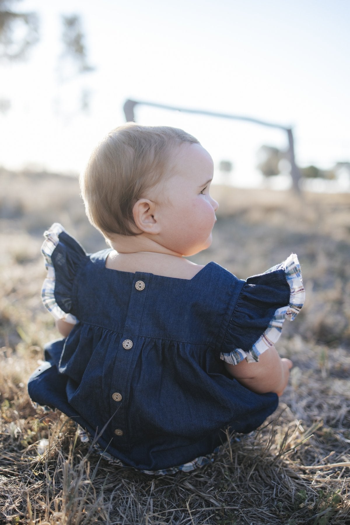 Denim romper back with button closure