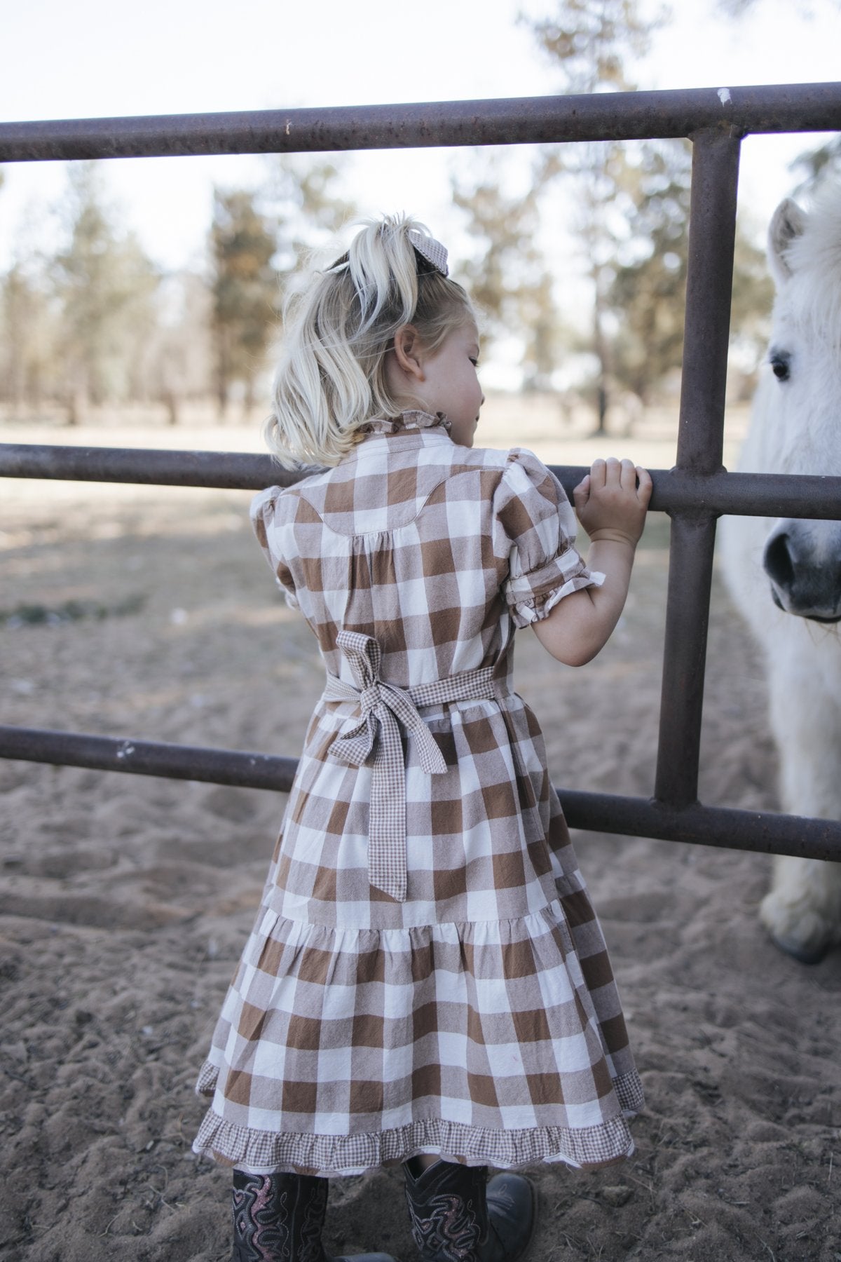 Girls brown gingham dress back view with waist tie