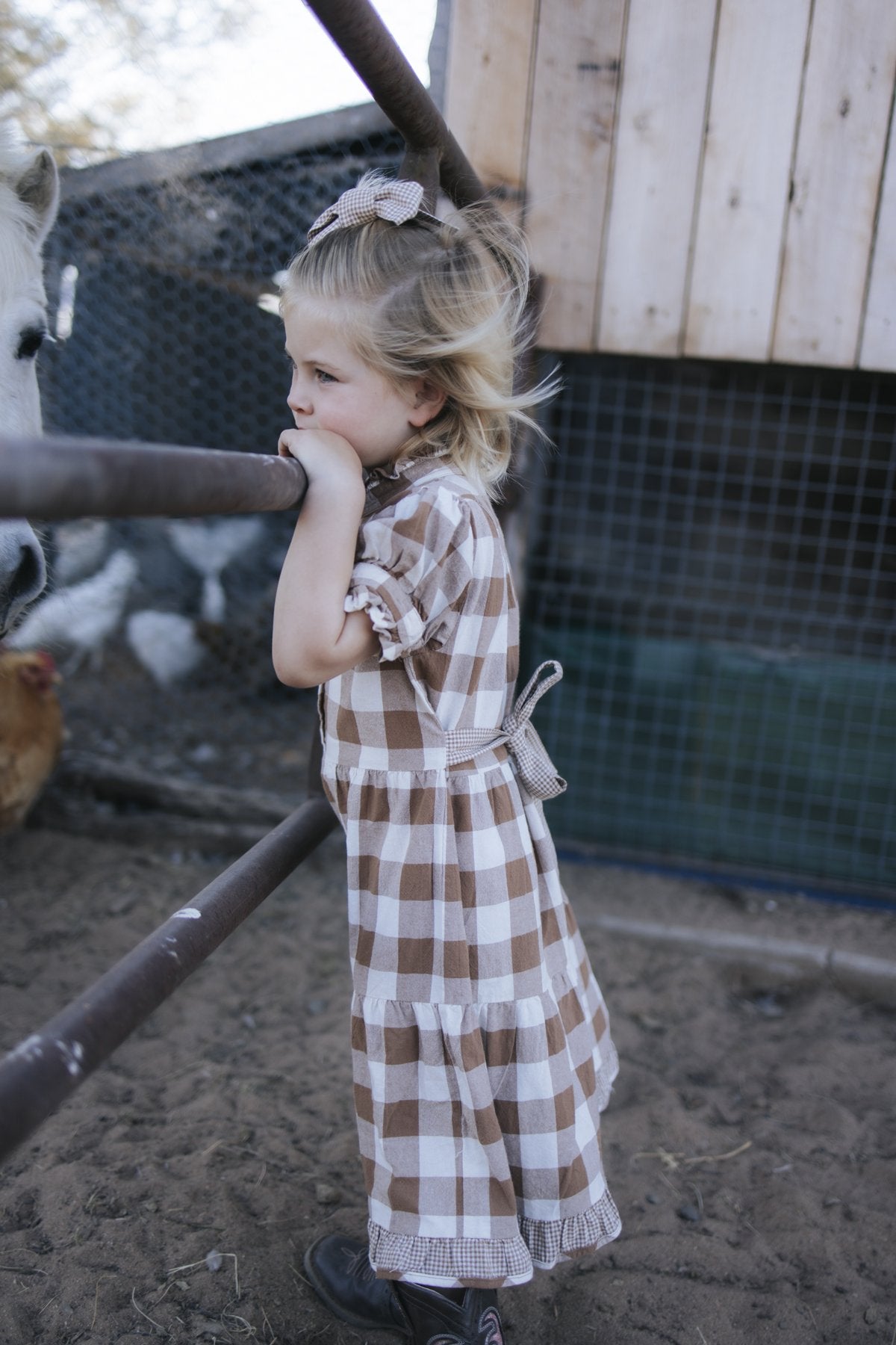 Girls brown gingham dress side view with tie