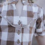 Gingham dress button placket and yoke detail