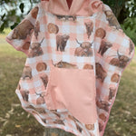 Peach Highlander kids waffle towel folded showing compact peach highlander print kids towel