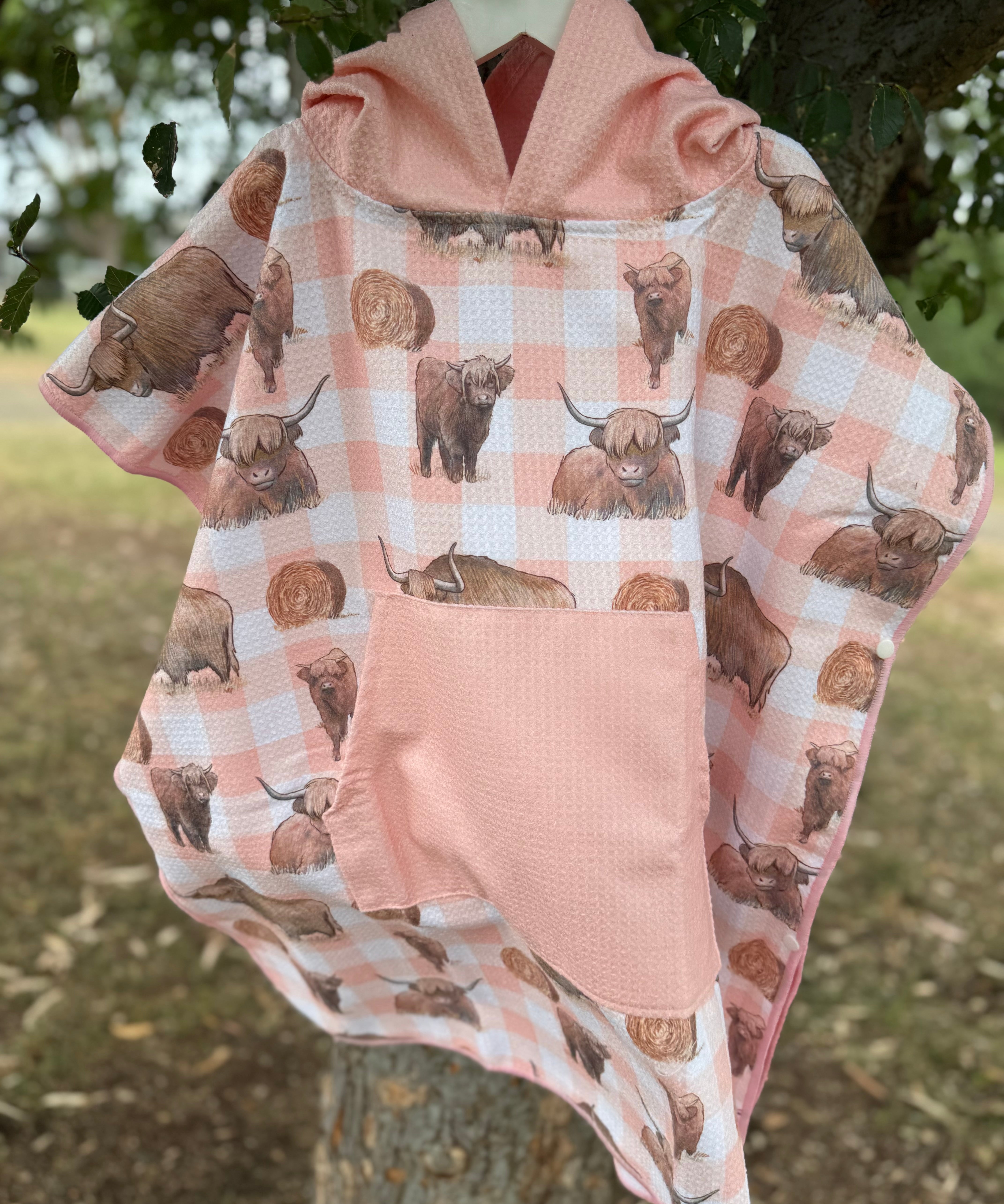 Peach Highlander kids waffle towel folded showing compact peach highlander print kids towel