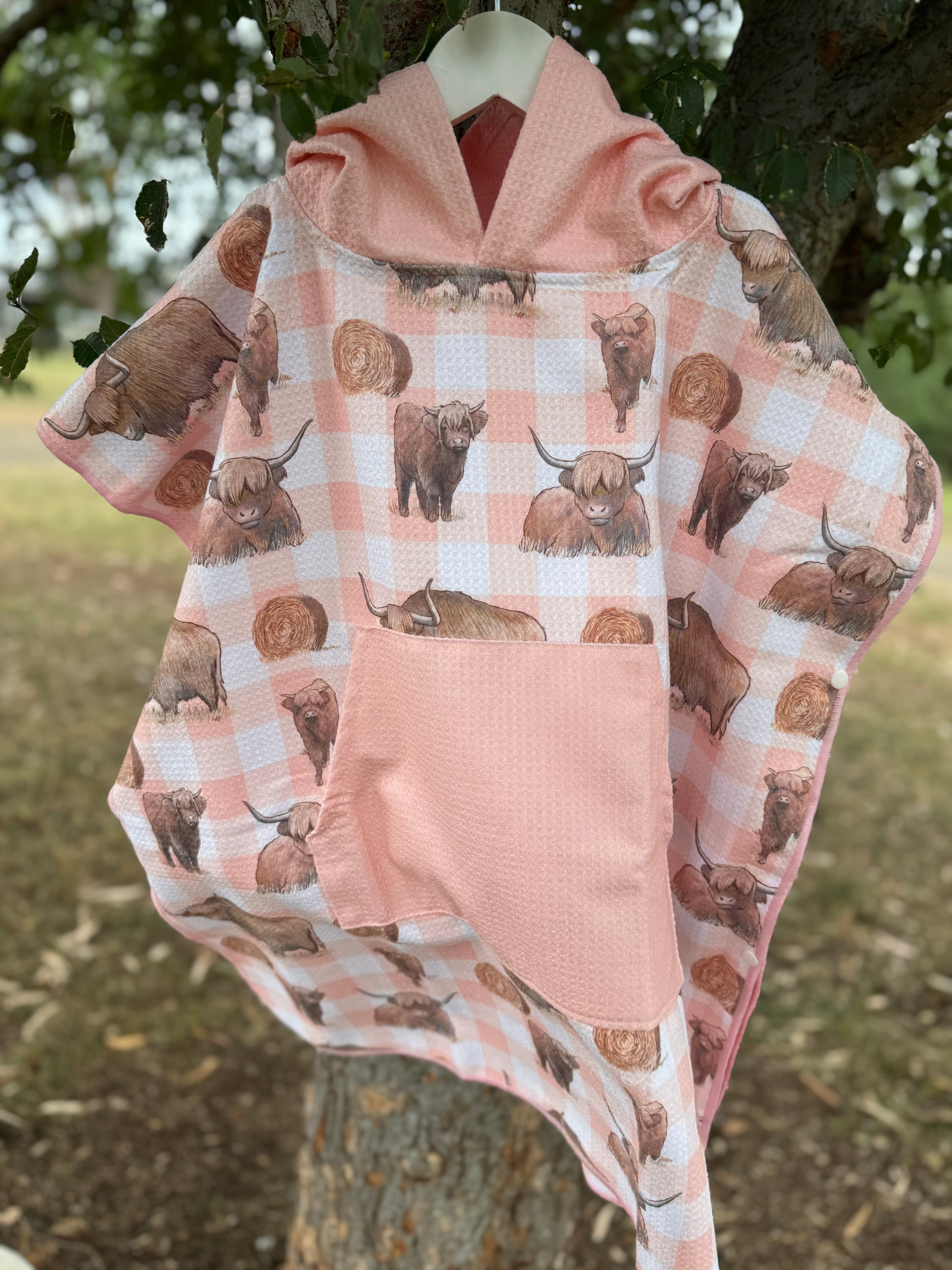 Peach Highlander kids waffle towel folded showing compact peach highlander print kids towel