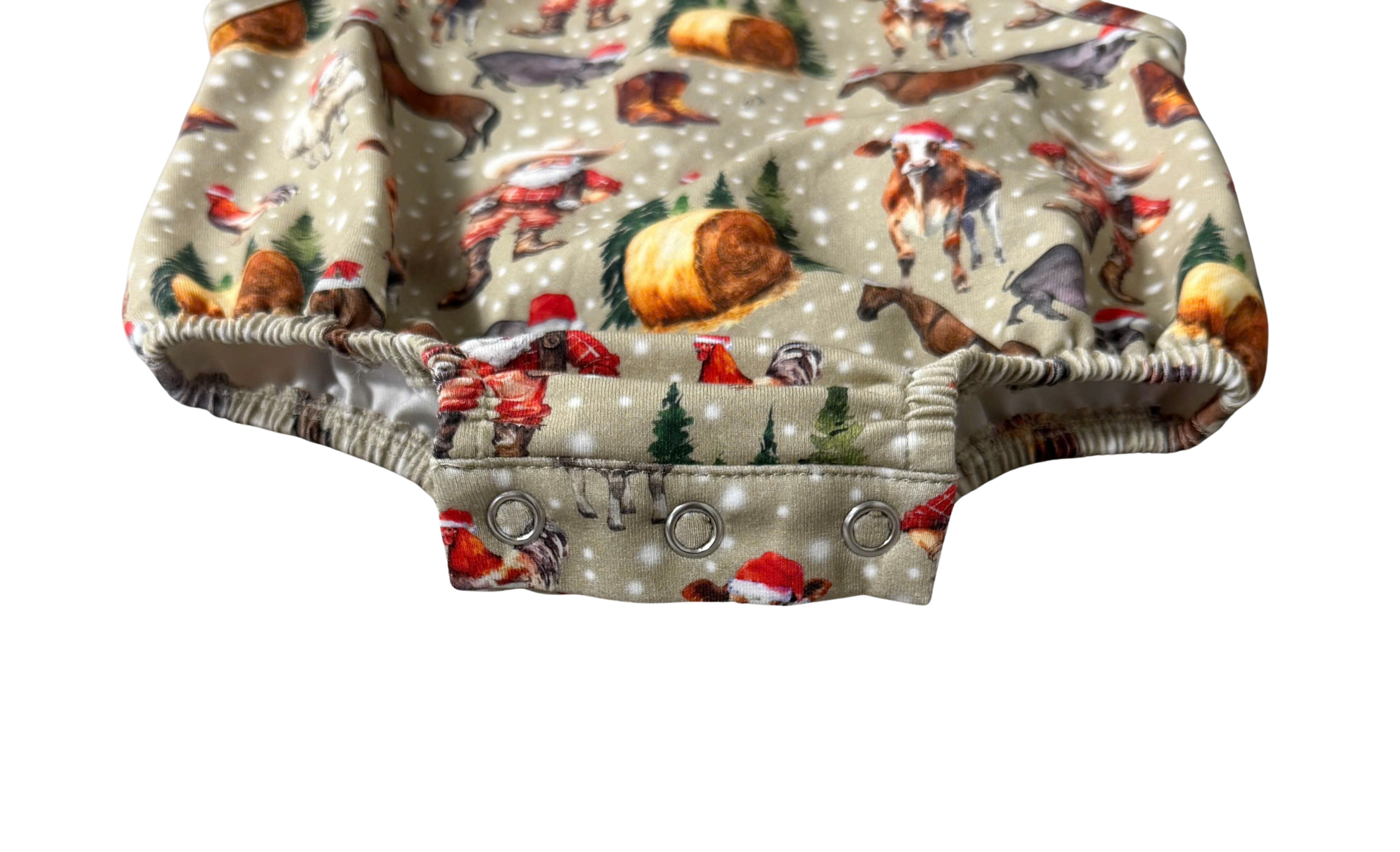 Christmas romper back view showing snap closure and festive holiday print
