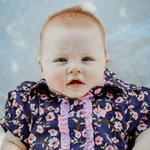 Harlo navy floral short sleeve romper front view showing sweet navy floral print romper for toddlers