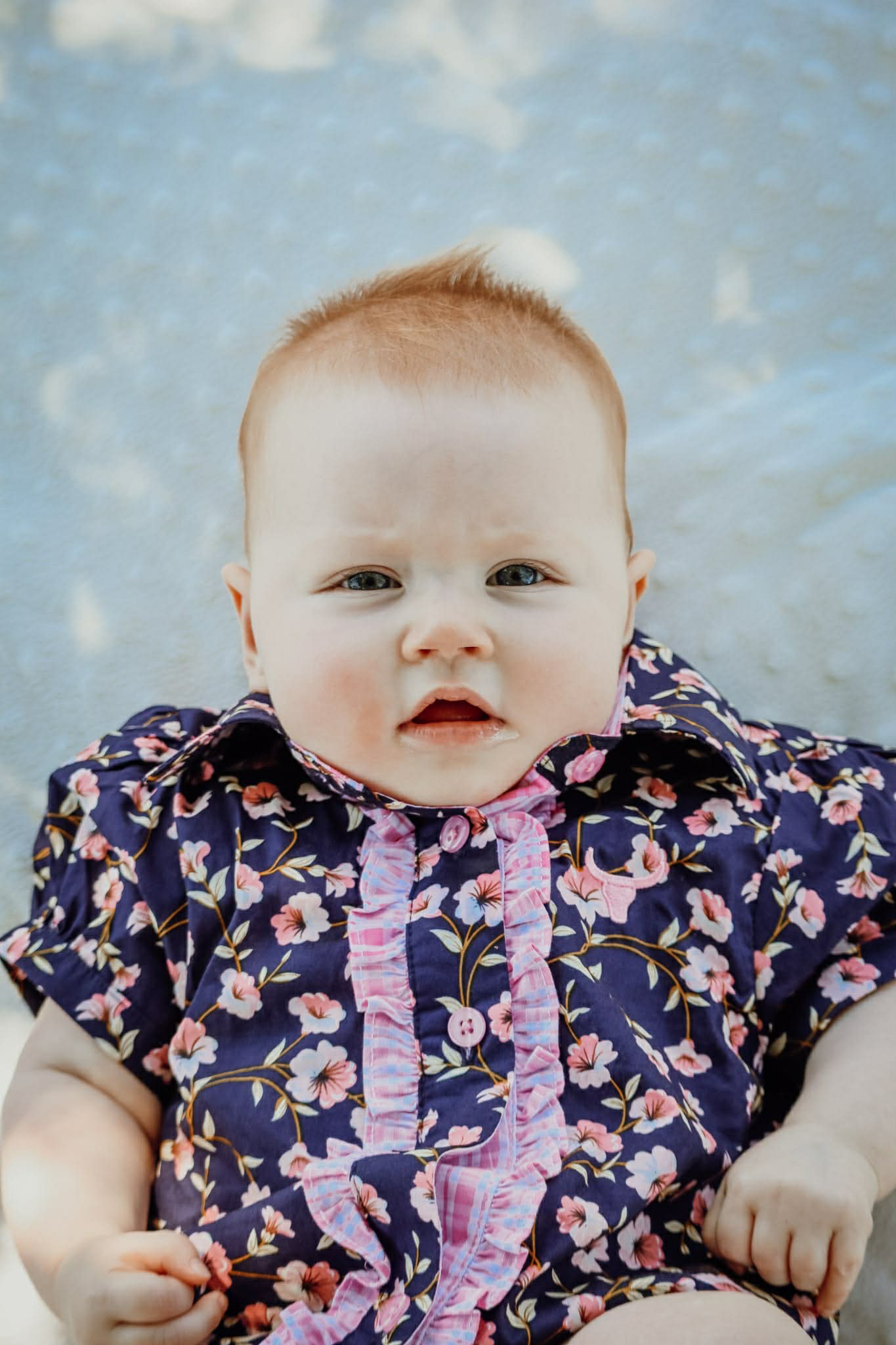 Harlo navy floral short sleeve romper front view showing sweet navy floral print romper for toddlers