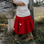 Rena deep red textured tutu waistband detail showing elastic waist and quality construction