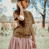Bella soft dust pink textured tutu side view showing full layered volume in soft dust pink
