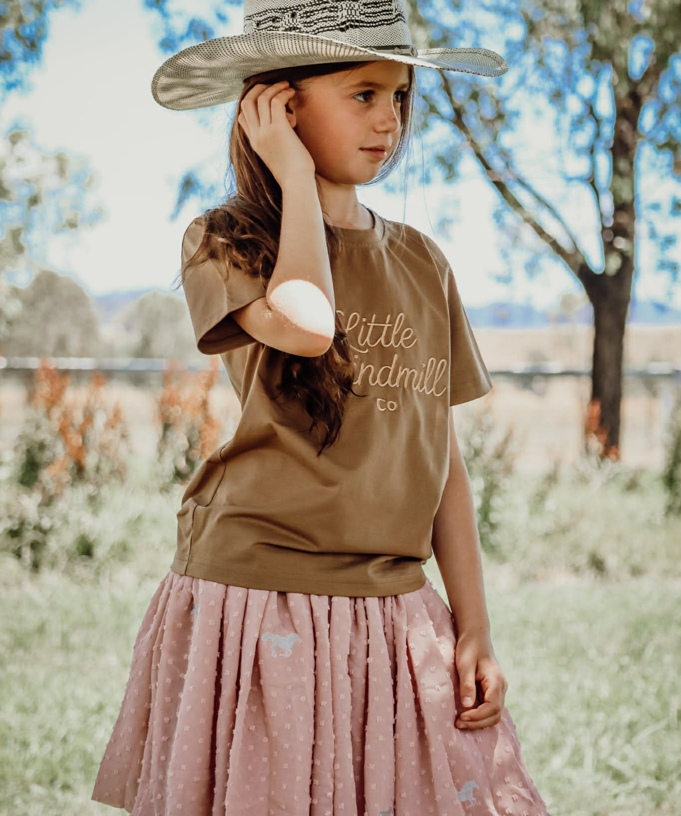 Bella soft dust pink textured tutu side view showing full layered volume in soft dust pink