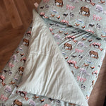 Country Outback nursery set showing cot quilt with removable insert in exclusive country print