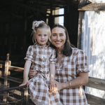 Girls gingham dress worn with matching ladies dress
