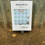 Teal cowgirl organic cotton swaddle draped showing large generous size for swaddling and wrapping