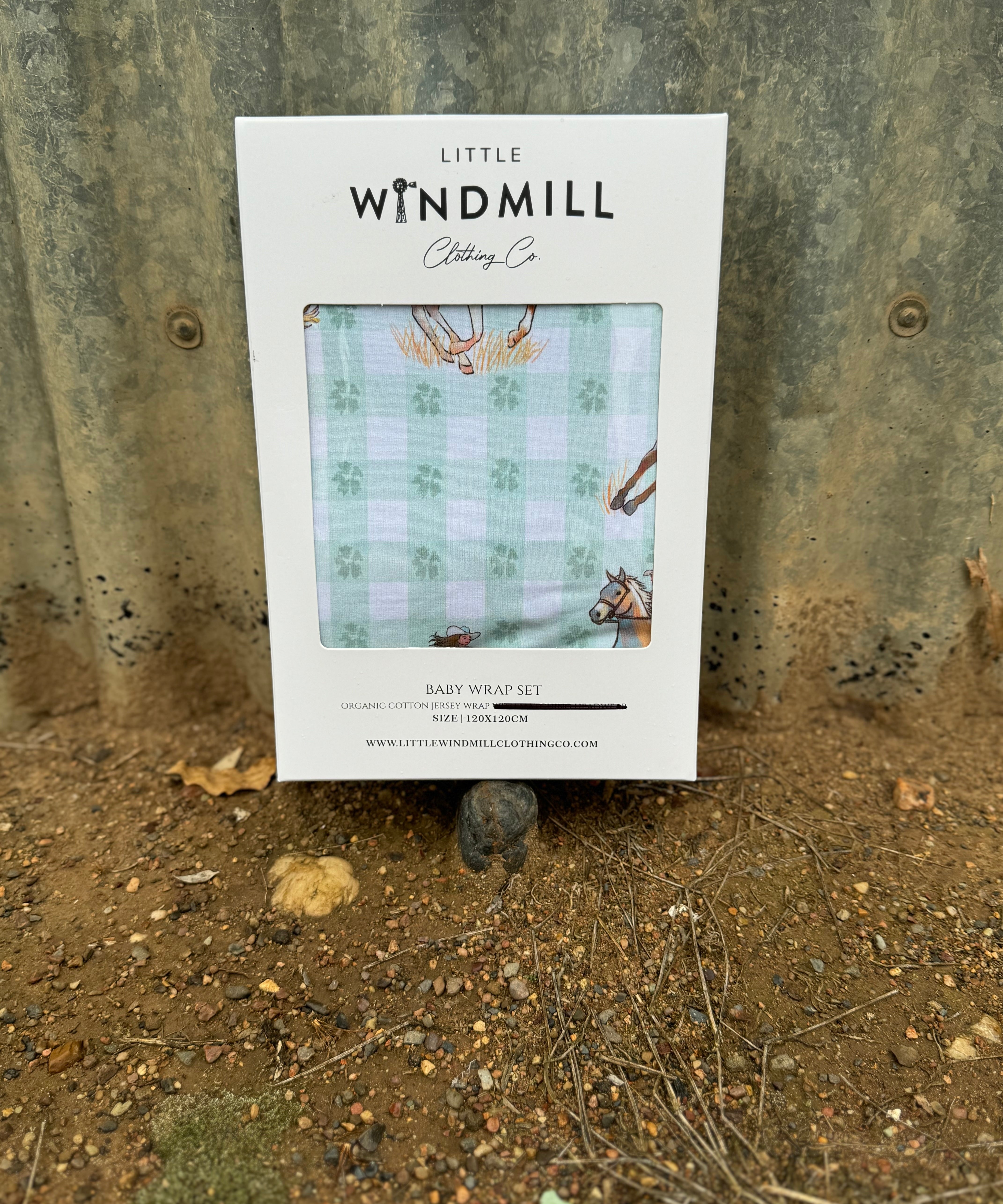 Teal cowgirl organic cotton swaddle draped showing large generous size for swaddling and wrapping