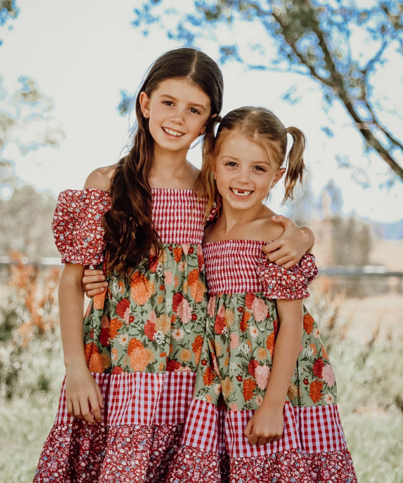 Penelope block twirl dress front view showing vibrant colour block layered twirl dress for girls
