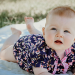 Harlo navy floral short sleeve romper back view showing snap closure and navy floral print