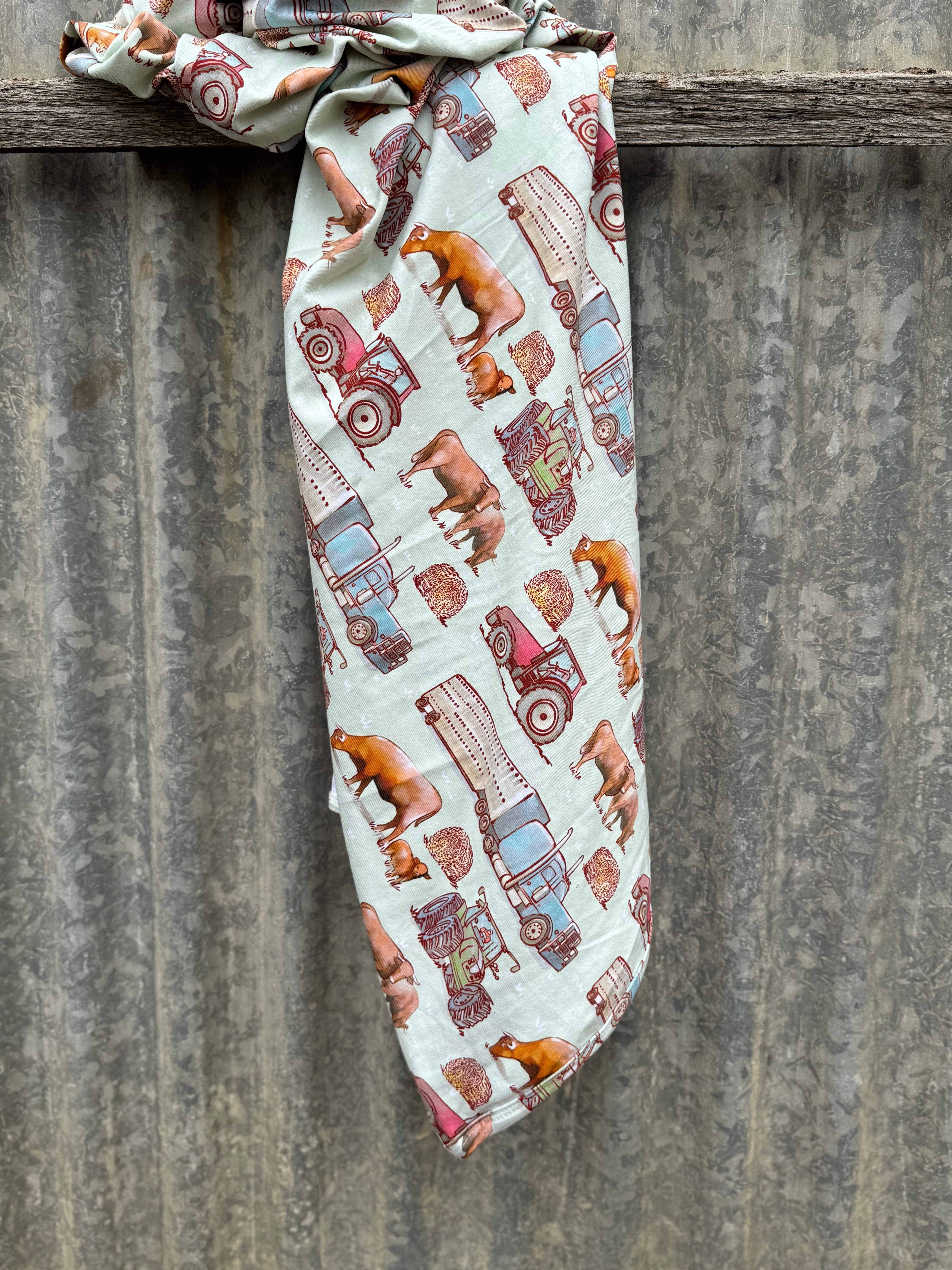 Ranch life jersey organic cotton swaddle showing classic ranch-themed print on 100% organic cotton