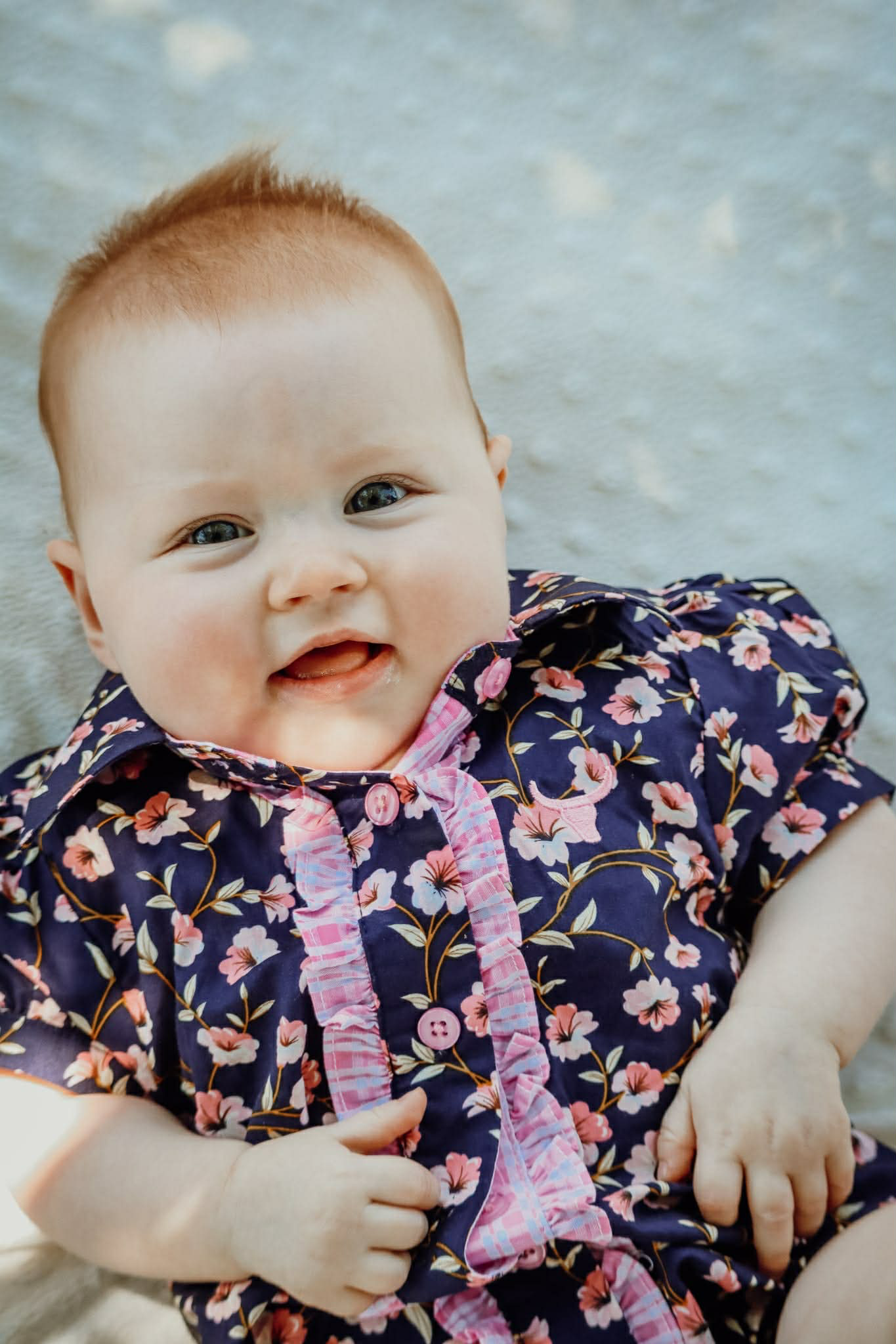 Harlo navy floral short sleeve romper print close-up showing detailed navy floral pattern