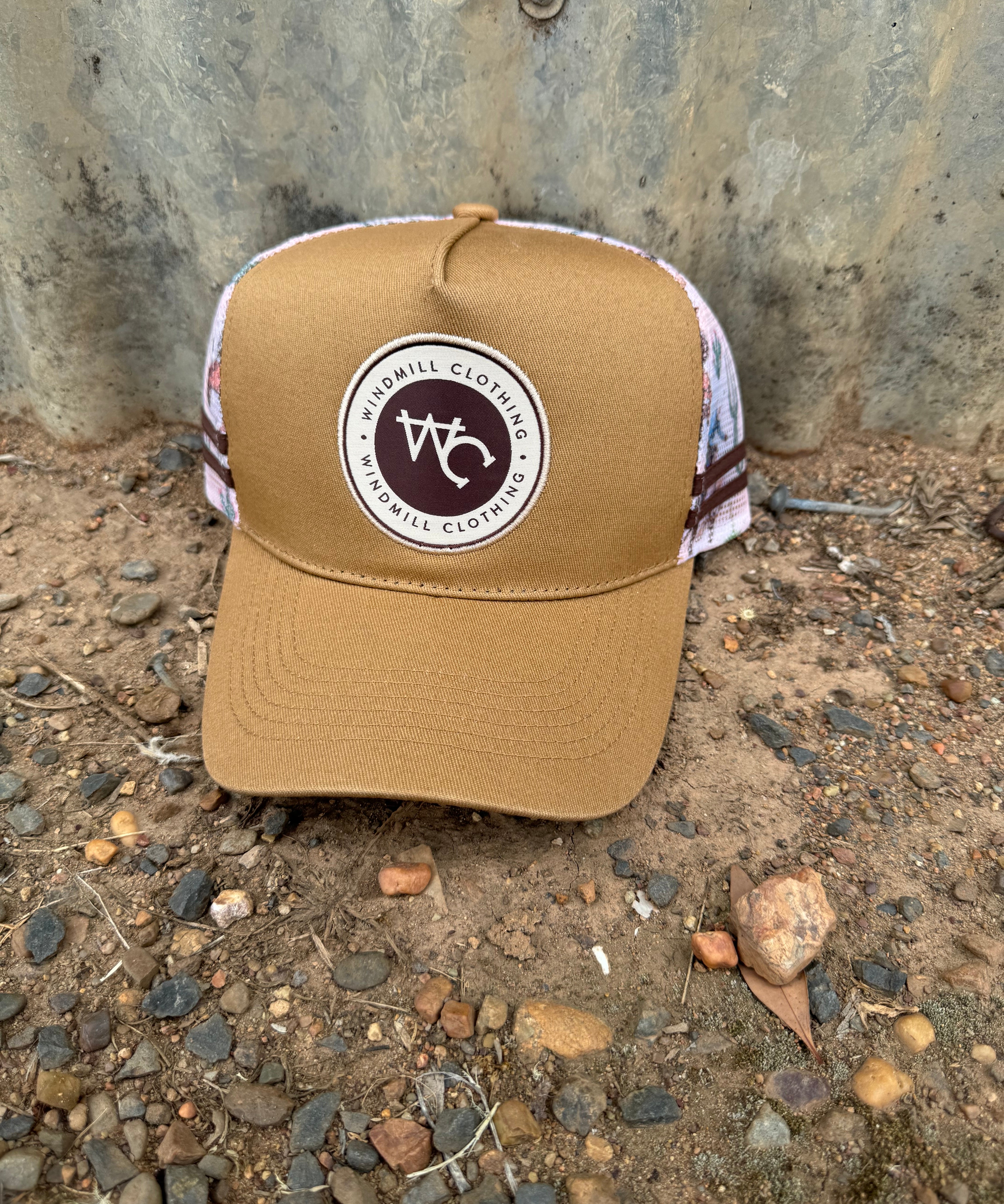 Adults and youth caramel bronc cap front view showing classic bronc rider emblem on warm caramel colourway