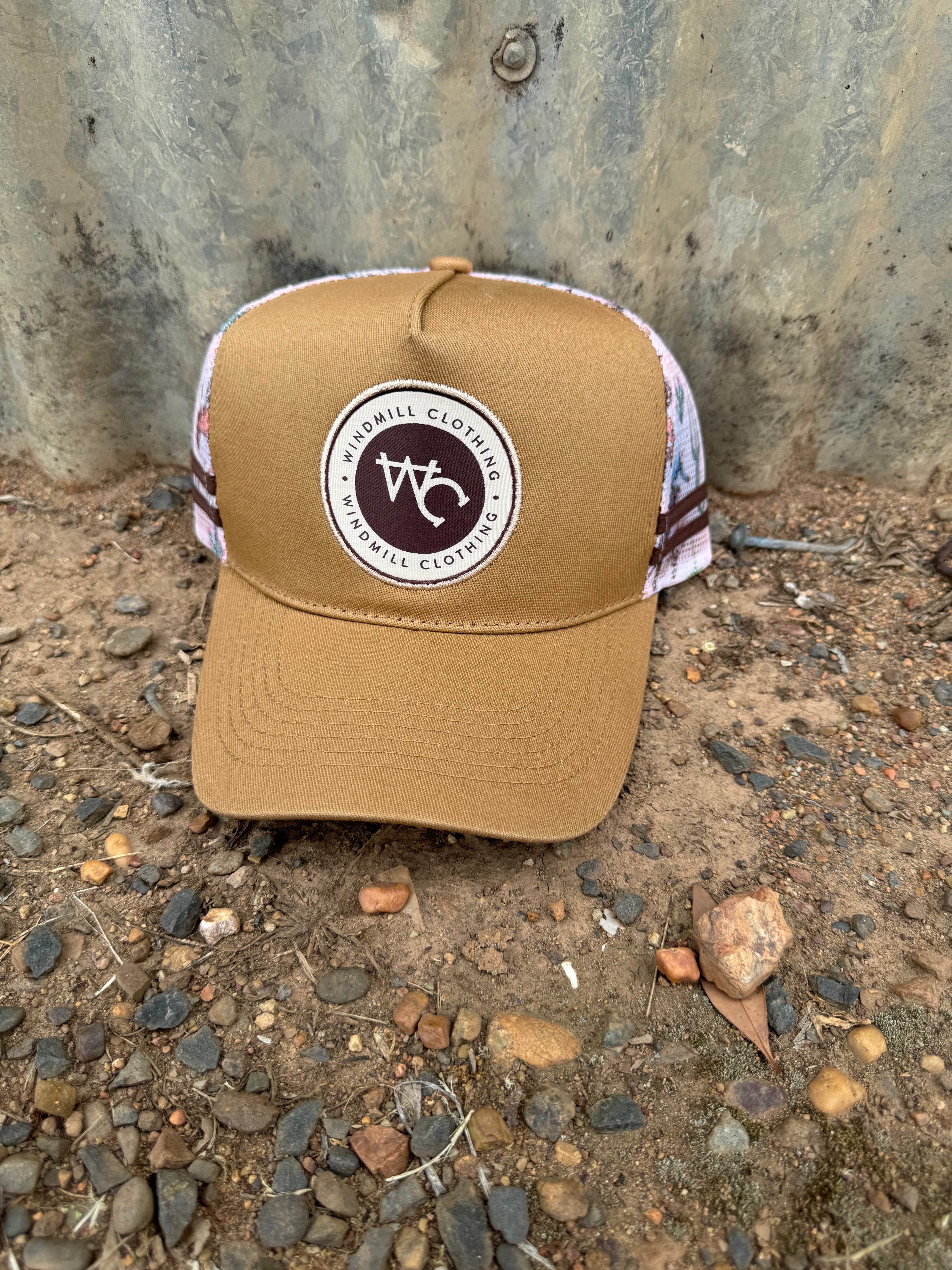 Adults and youth caramel bronc cap front view showing classic bronc rider emblem on warm caramel colourway