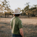 Olive Guy green contrast men's polo on model showing country lifestyle fit