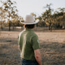 Olive Guy green contrast men's polo on model showing country lifestyle fit