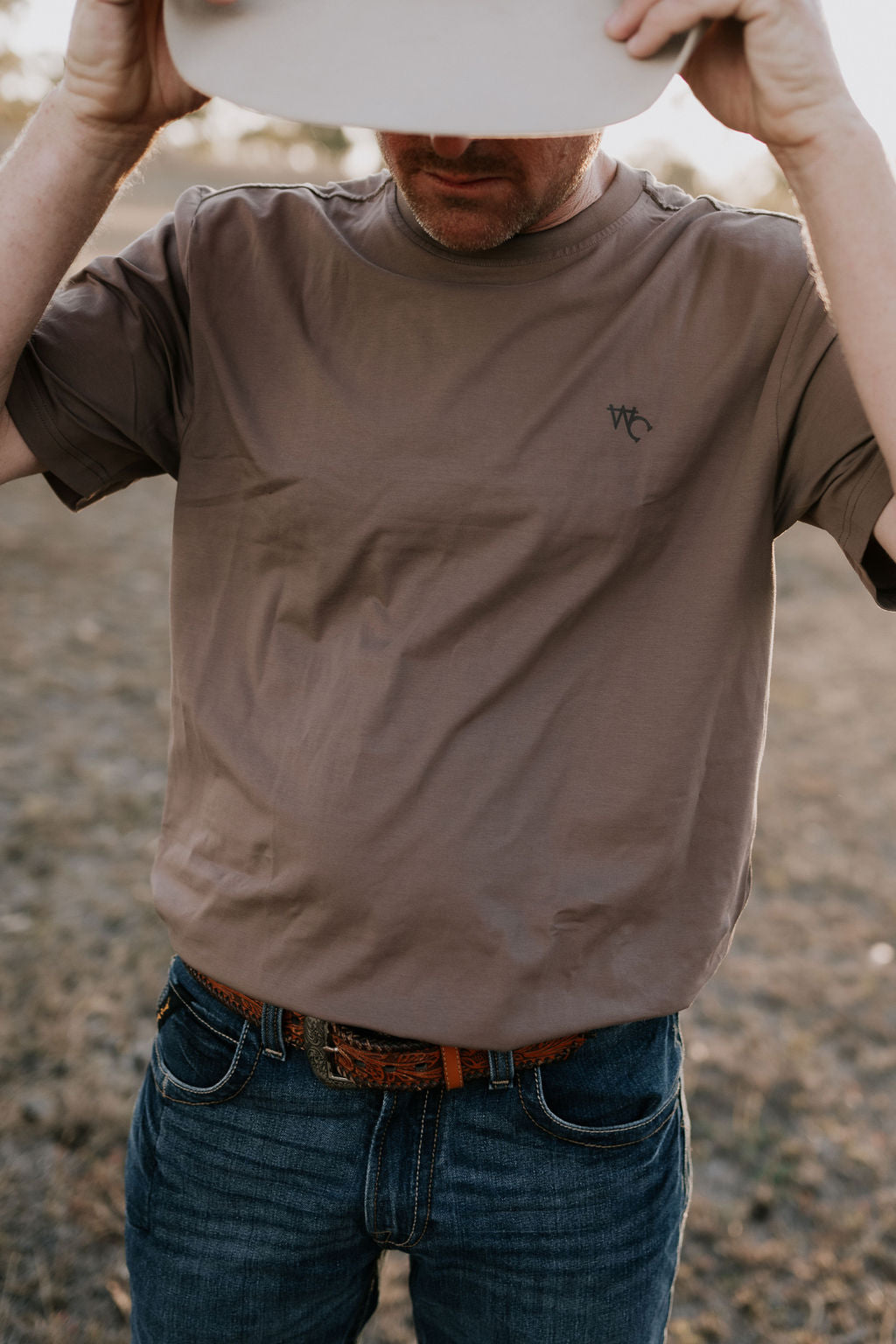 WC Printed Men's Tee Dust on model outdoors showing country casual style