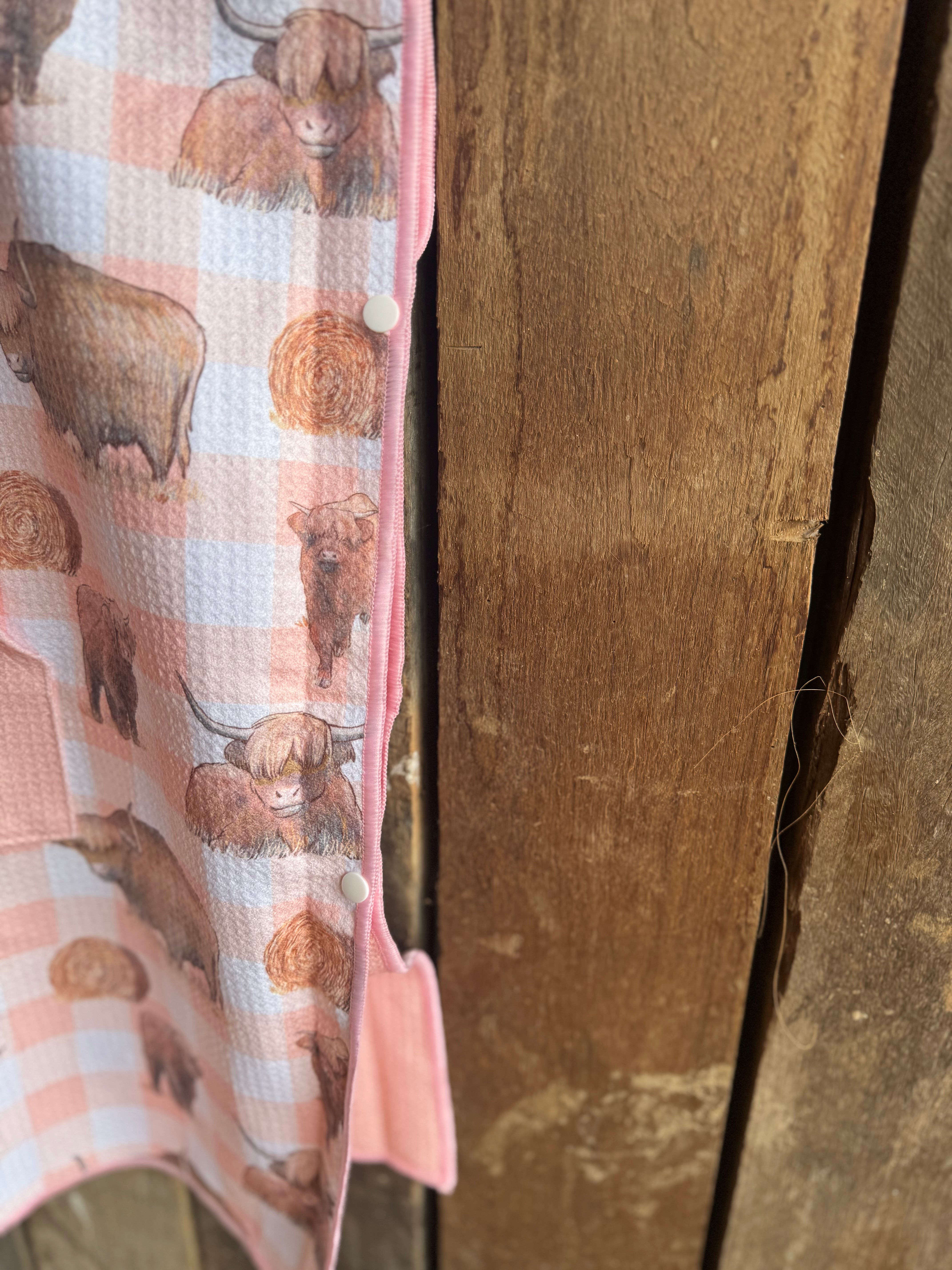 Peach Highlander kids waffle towel in use showing kids towel with peach highlander print
