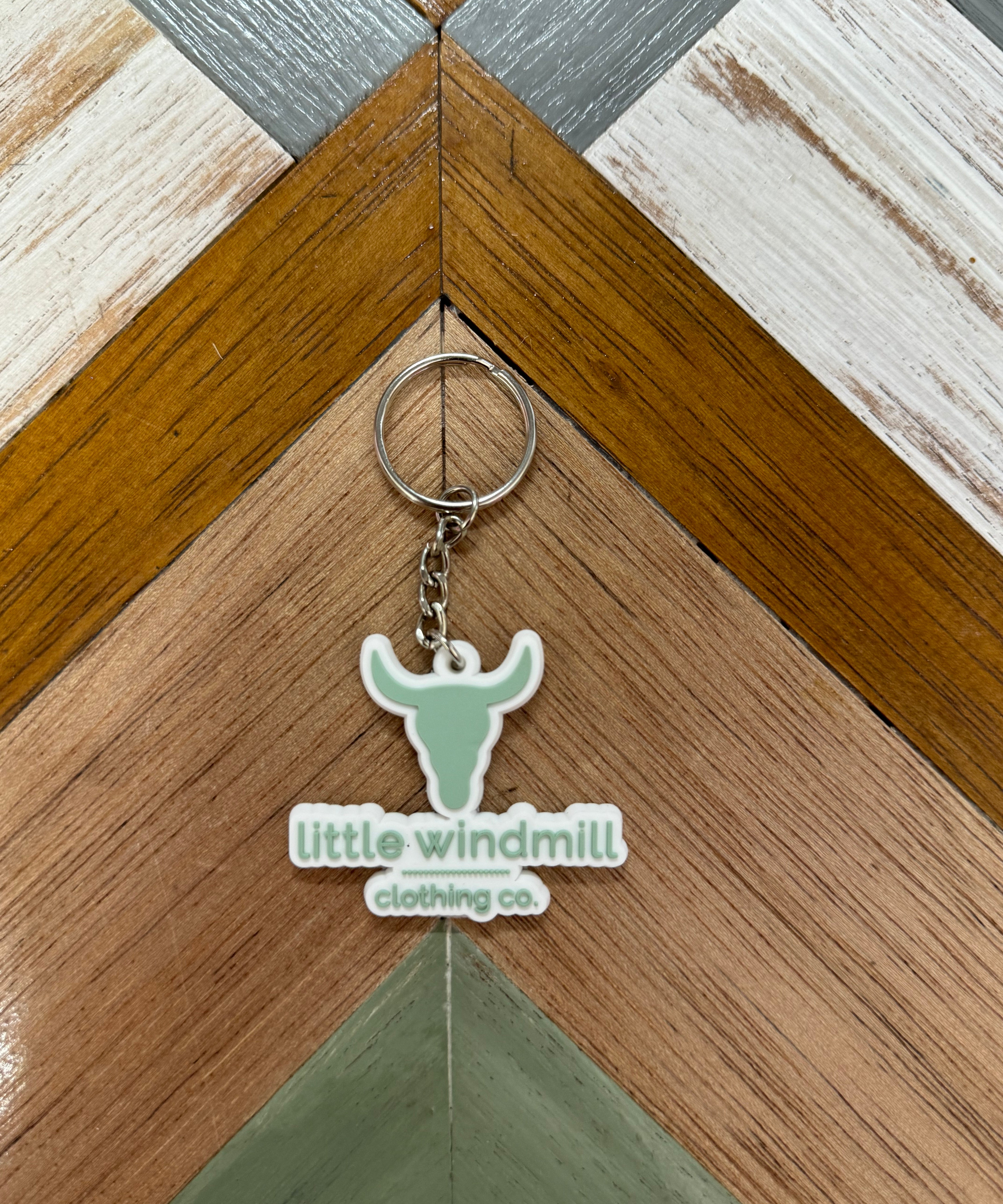 Little Windmill Clothing Co key chain showing branded accessory with windmill logo detail
