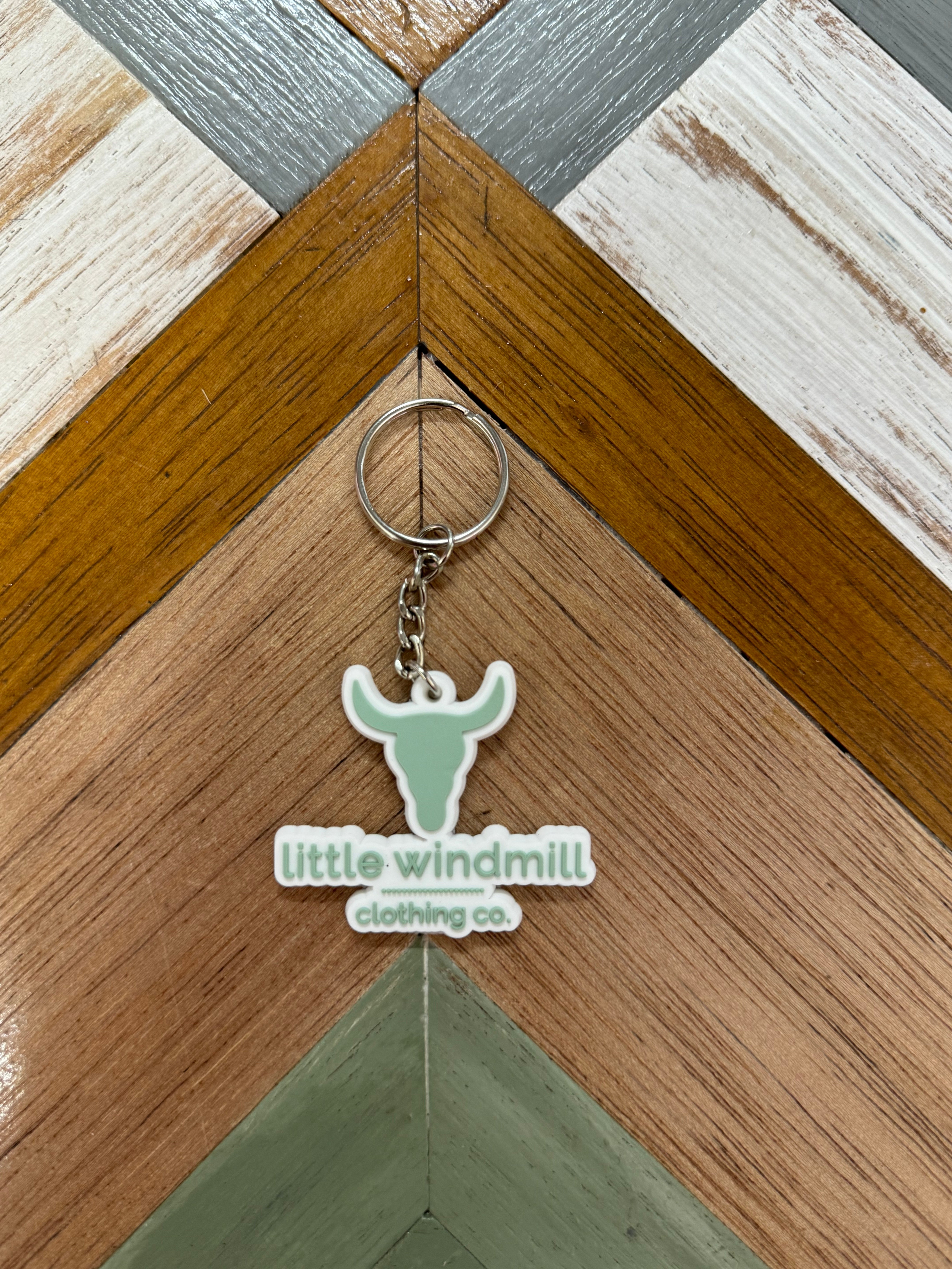 Little Windmill Clothing Co key chain showing branded accessory with windmill logo detail