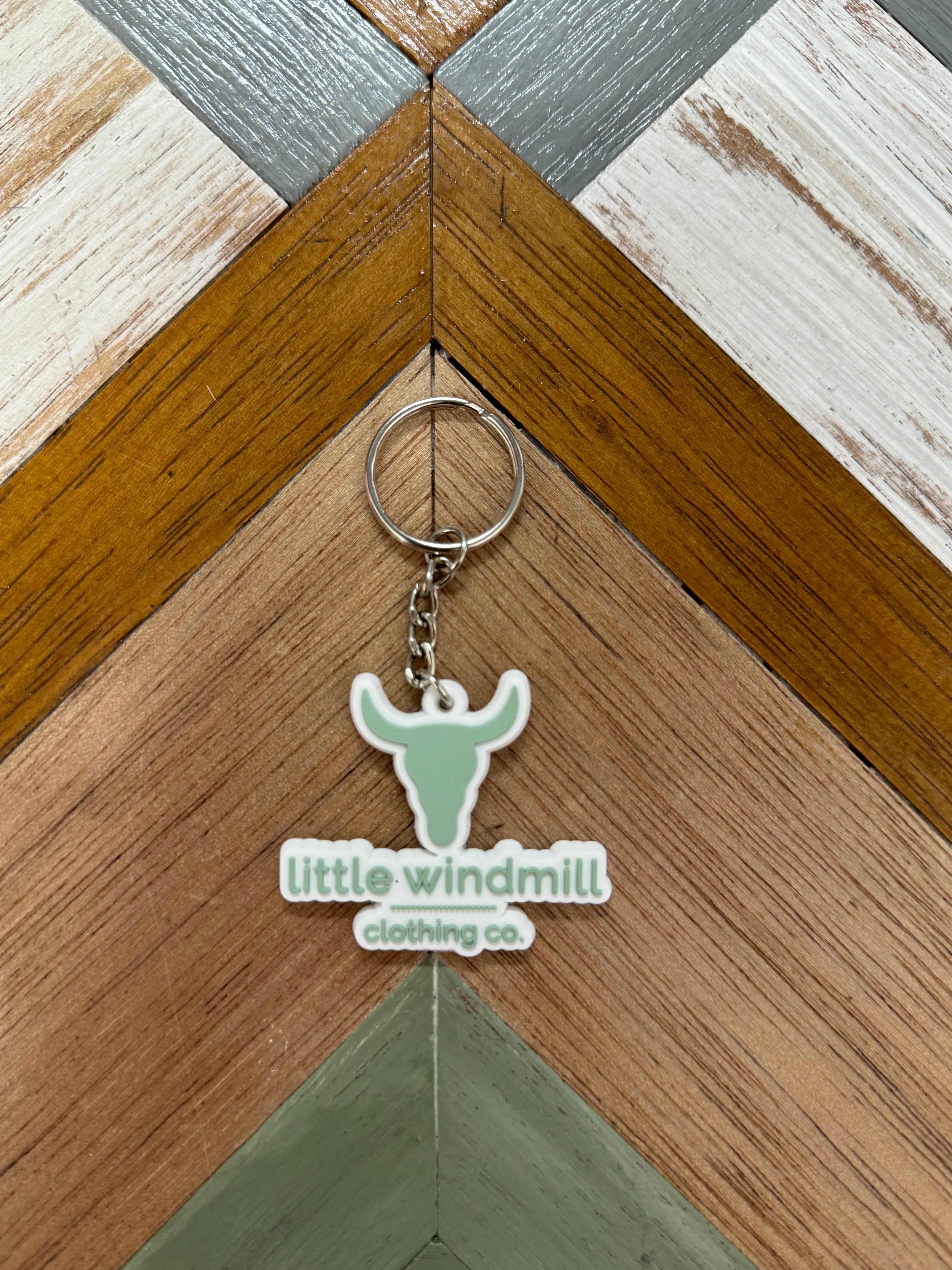 Little Windmill Clothing Co key chain close-up showing quality metal detail and LWCC branding