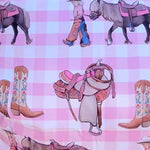 Cowgirl Life fitted cot sheet fabric close-up showing quality soft cotton cowgirl print