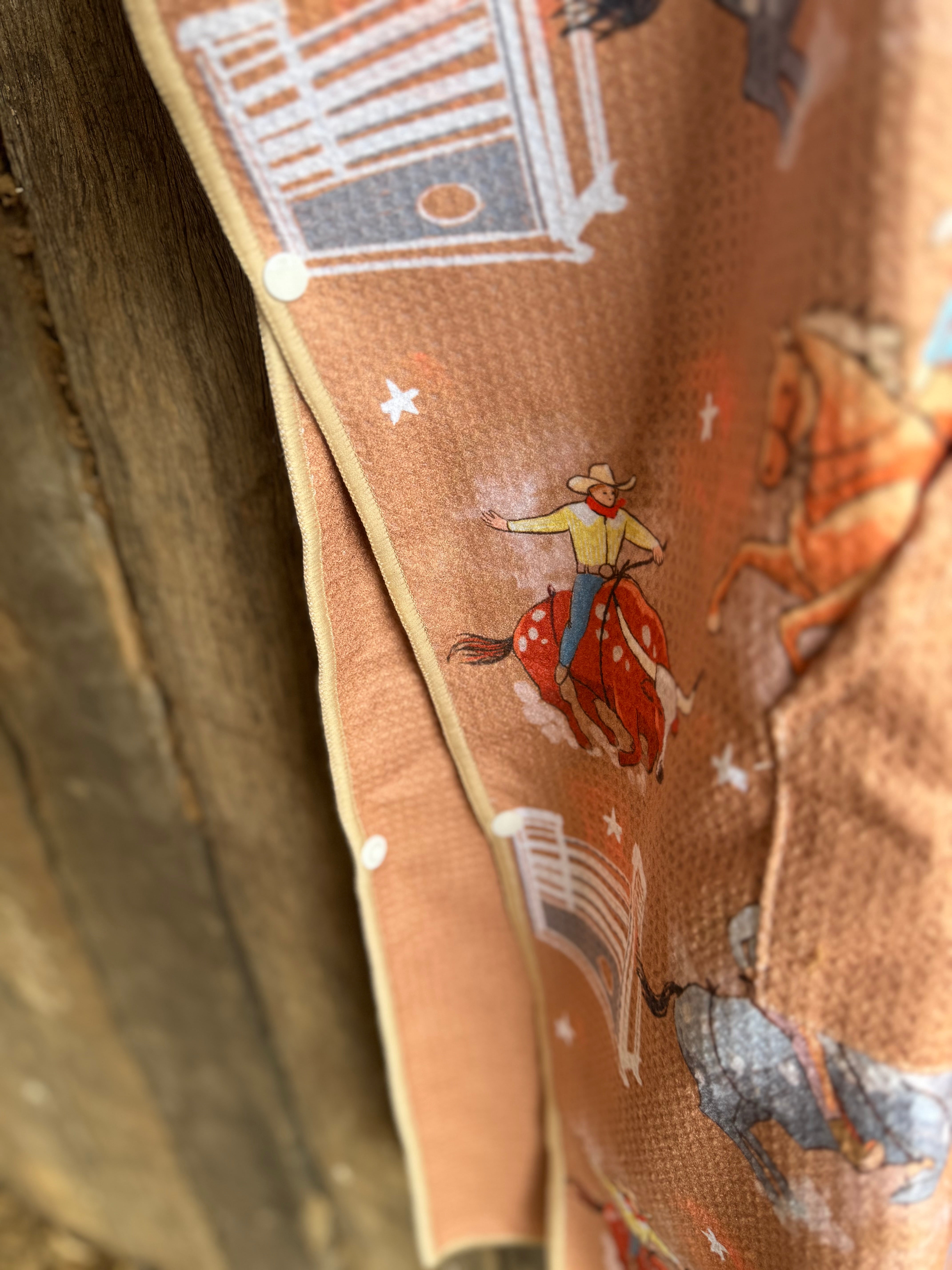 Bull Rider brown kids waffle towel detail showing cool bull rider print and soft waffle cotton