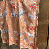 Bull Rider brown kids waffle towel in use showing kids towel with bull rider print