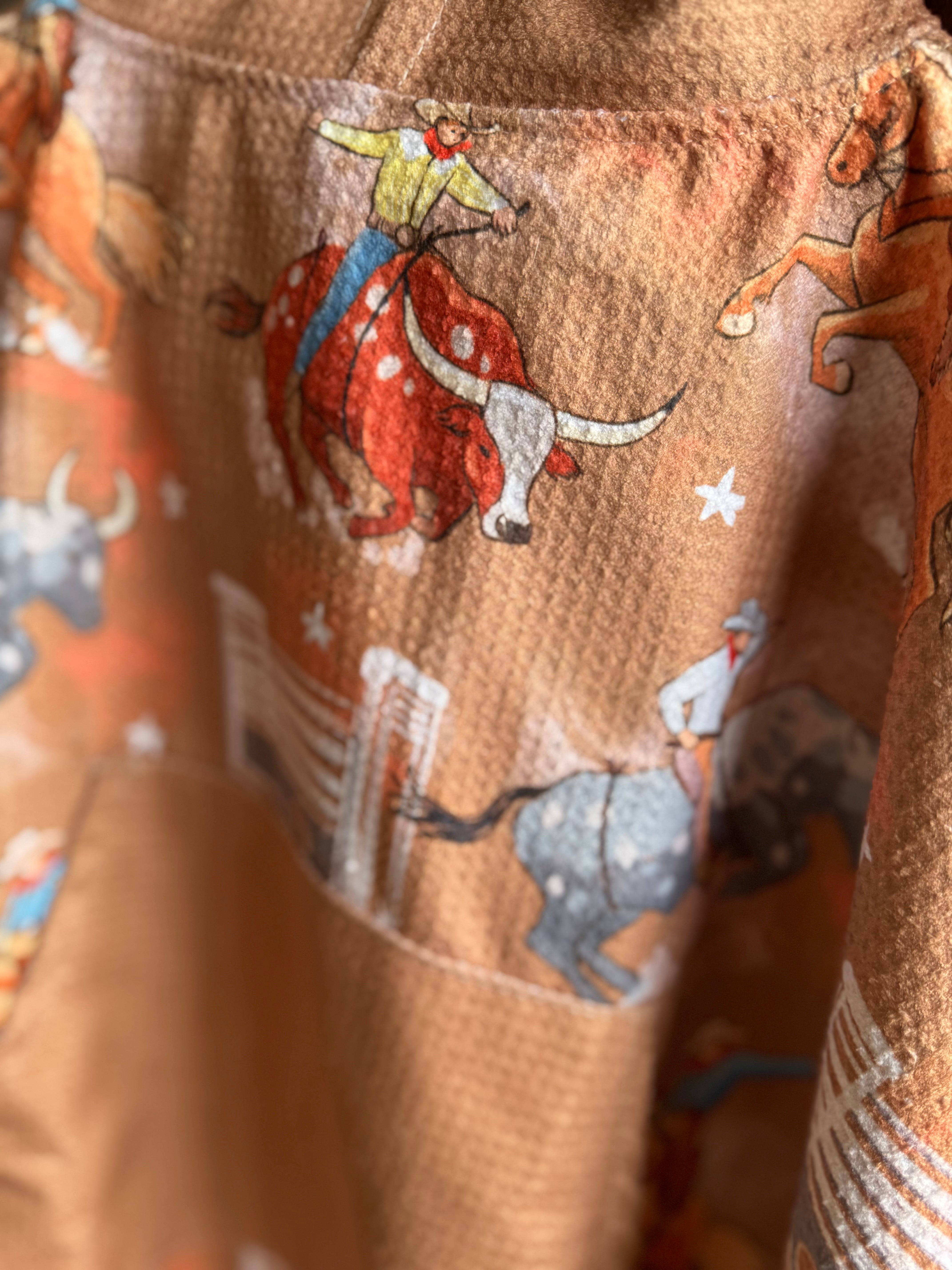 Bull Rider brown kids waffle towel edge detail showing quality finished edges on kids waffle towel