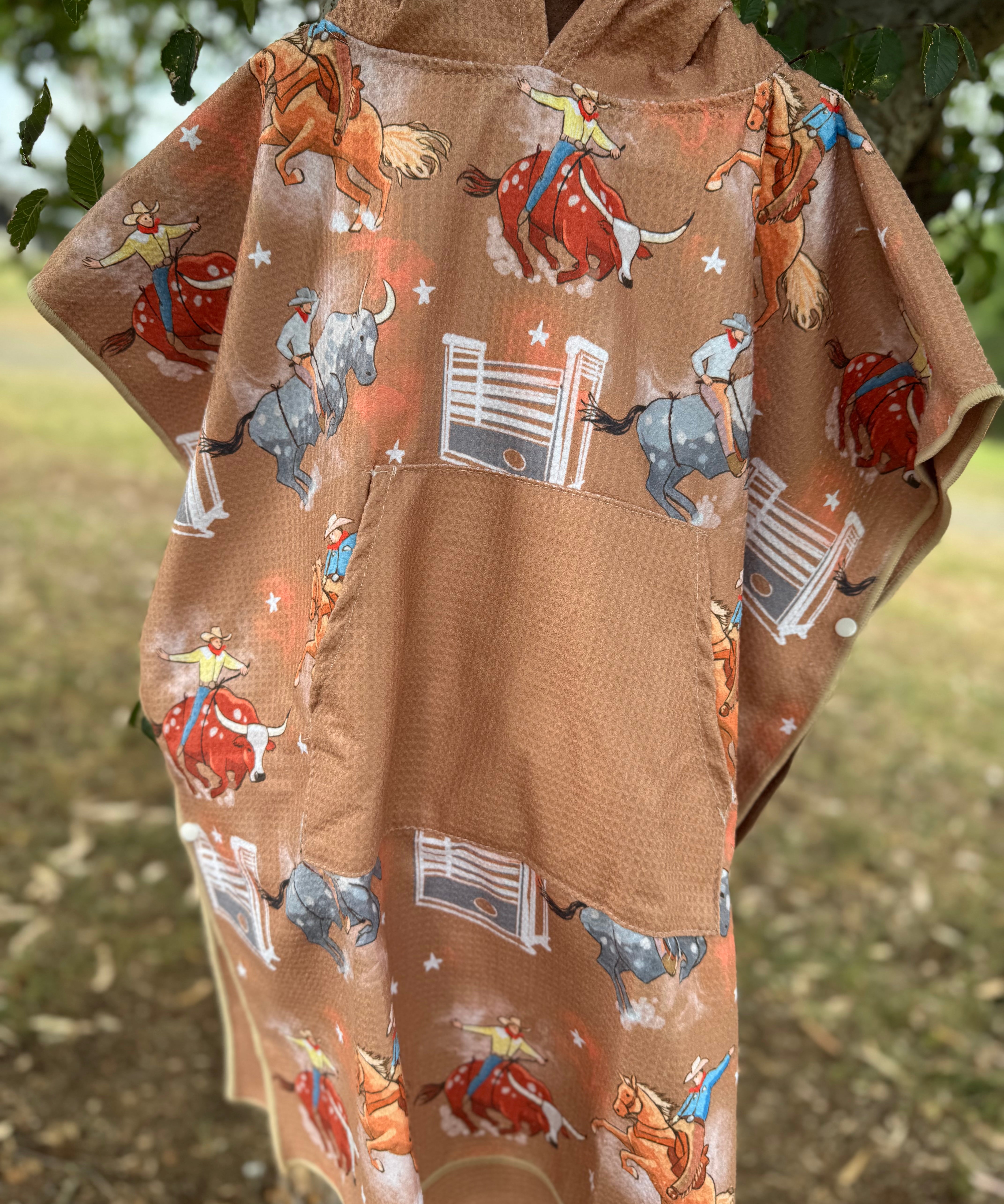 Bull Rider brown kids waffle towel folded showing compact bull rider print kids towel