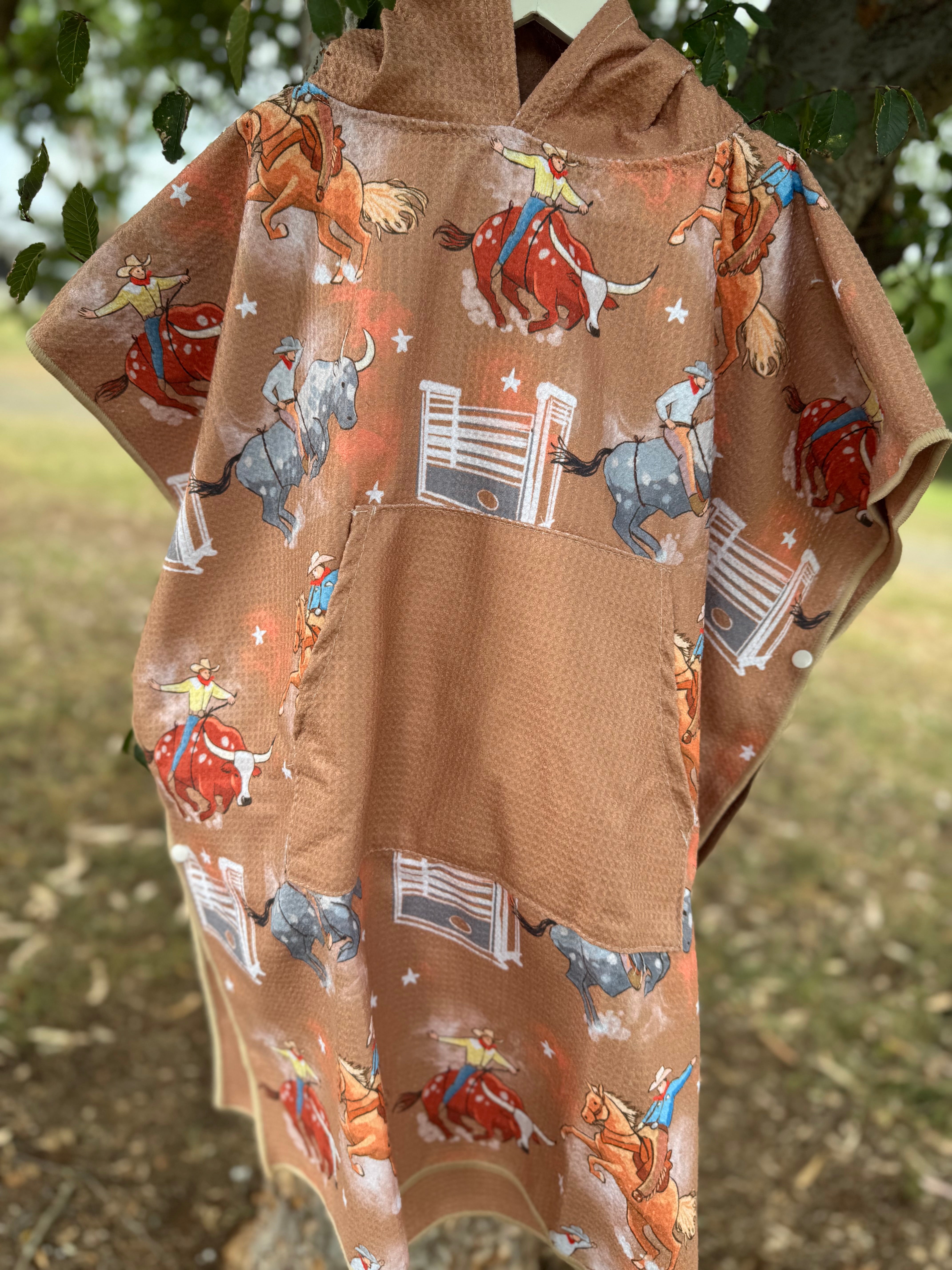Bull Rider brown kids waffle towel folded showing compact bull rider print kids towel