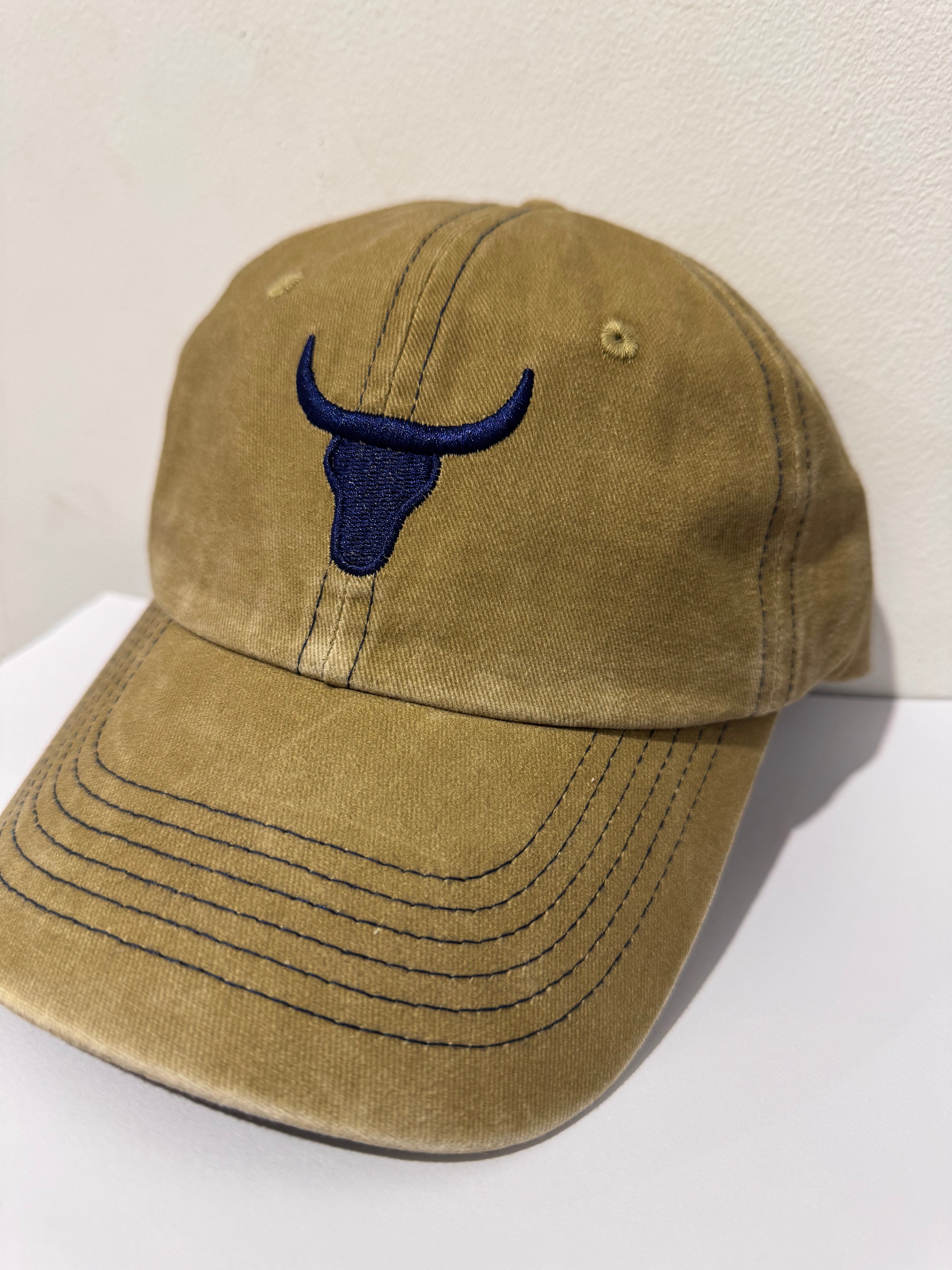 Baseball cap one size strap detail showing adjustable rear strap for one size fit