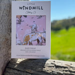 Pink long horn organic cotton swaddle draped showing generous swaddle size and softness