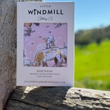 Pink long horn organic cotton swaddle draped showing generous swaddle size and softness
