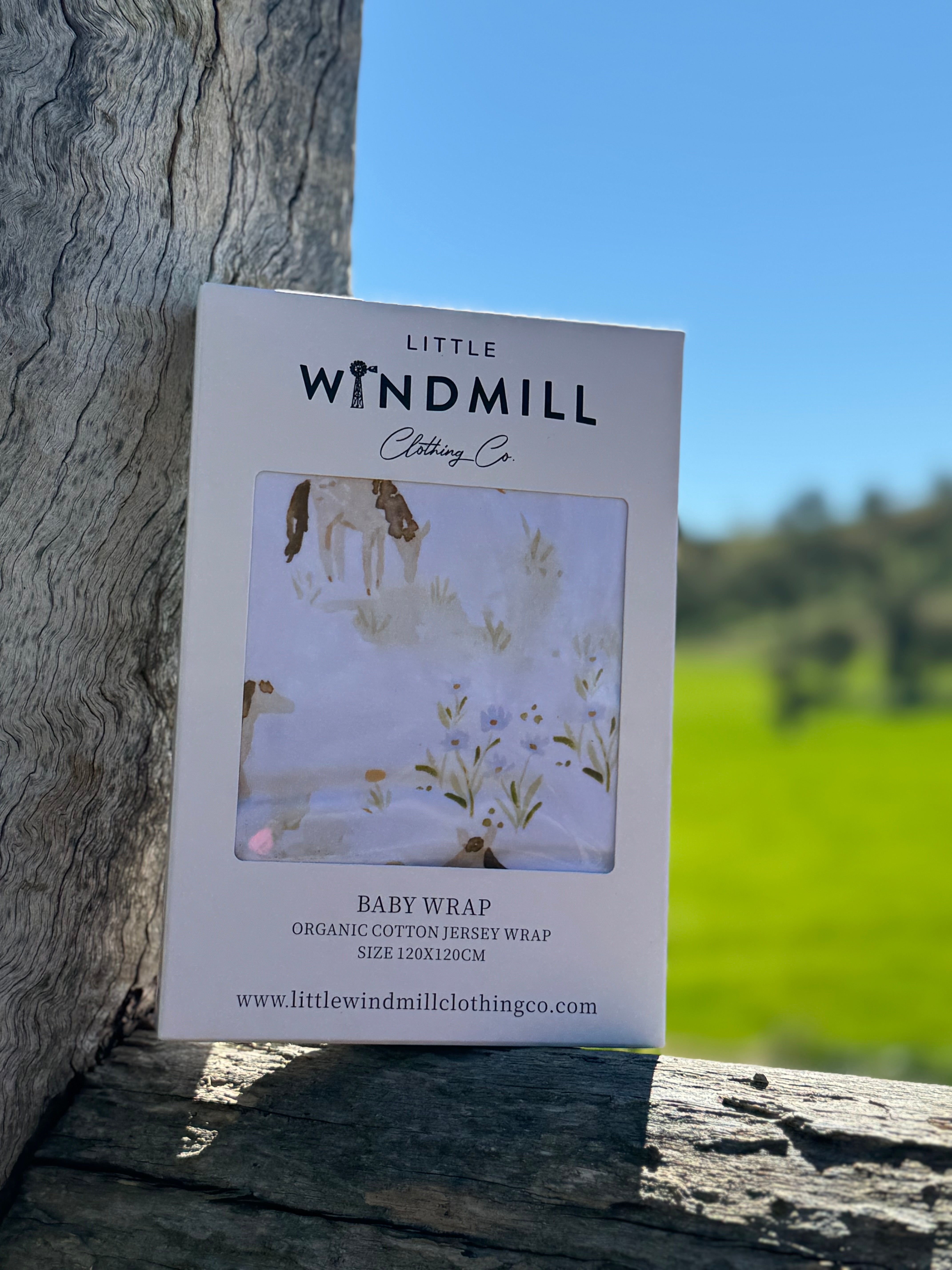 Horse field organic cotton swaddle open flat lay showing full size and pastoral horse scene