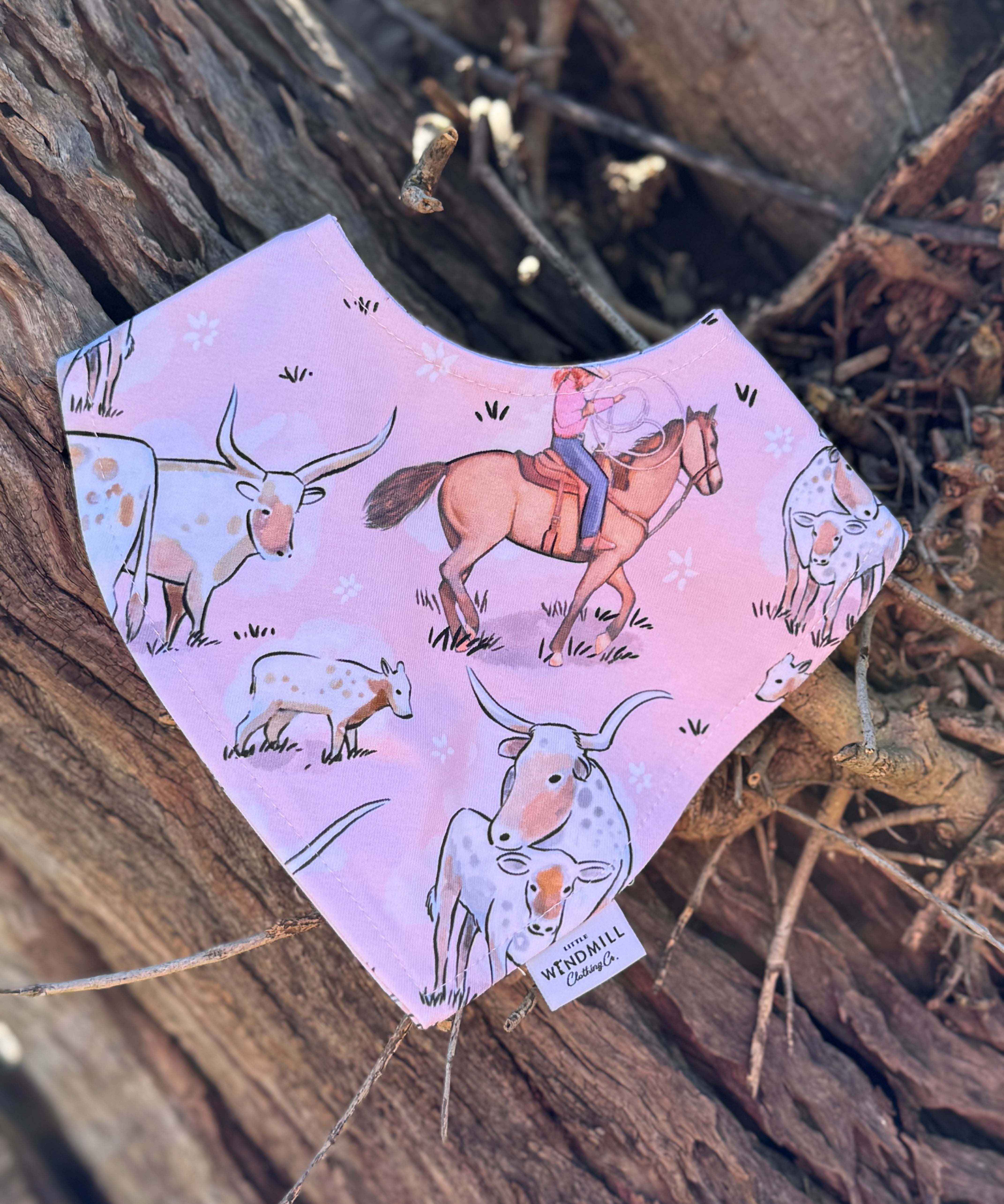 Waterproof pink long horn bib back showing easy-clean wipeable surface and adjustable fastening