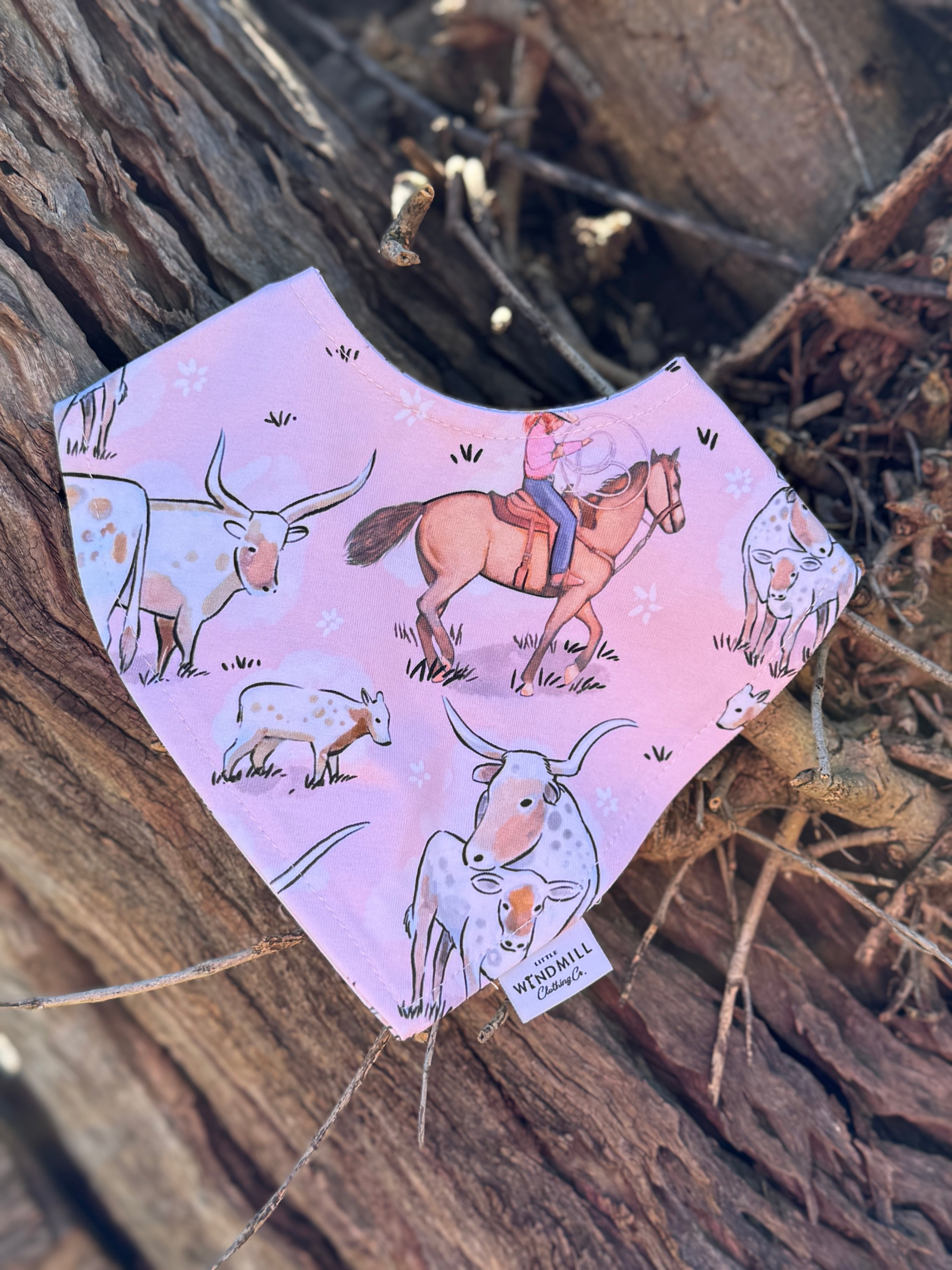Waterproof pink long horn bib back showing easy-clean wipeable surface and adjustable fastening